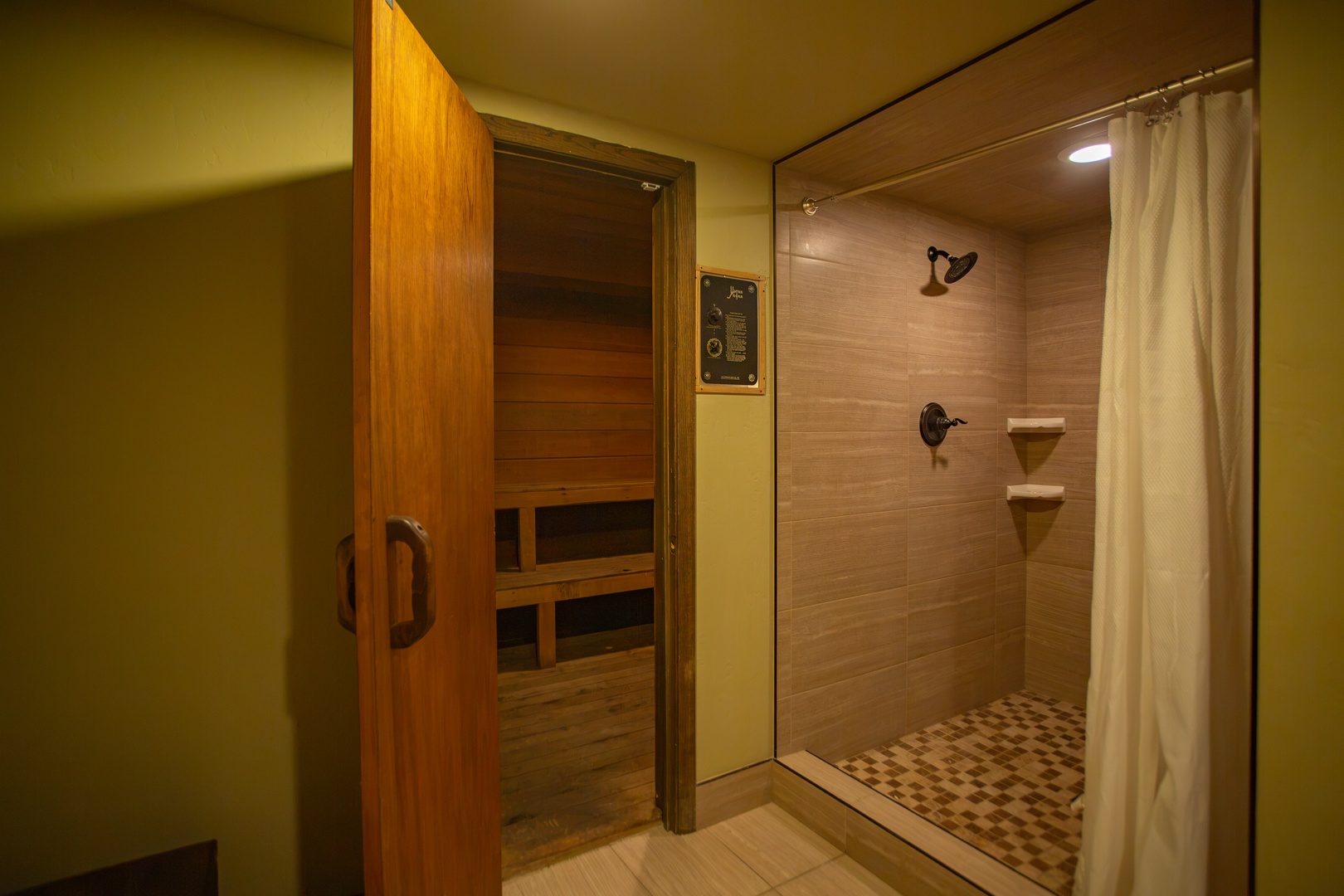 Unwind in your shared sauna before stepping into the spacious walk-in shower—your personal spa retreat awaits after a day of adventure.