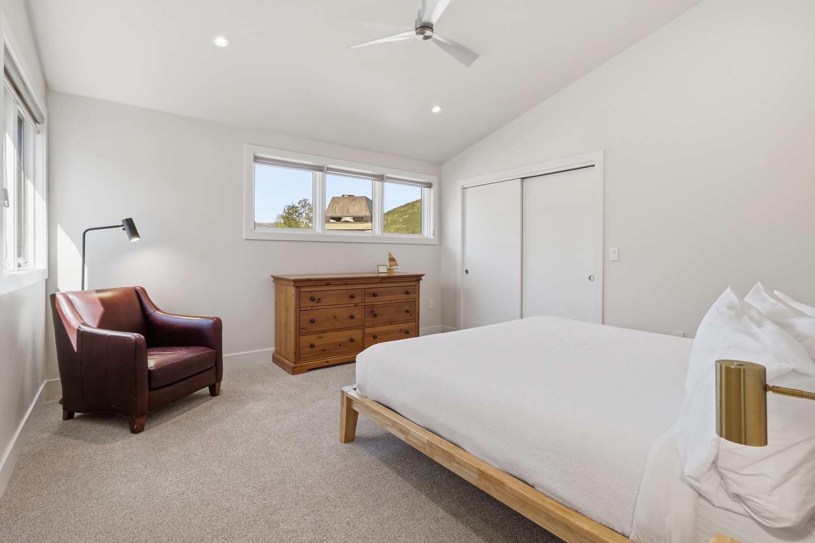 Sink into crisp linens and wake up to mountain views framed by your window. Your peaceful bedroom offers comfort and natural light for restful mornings.