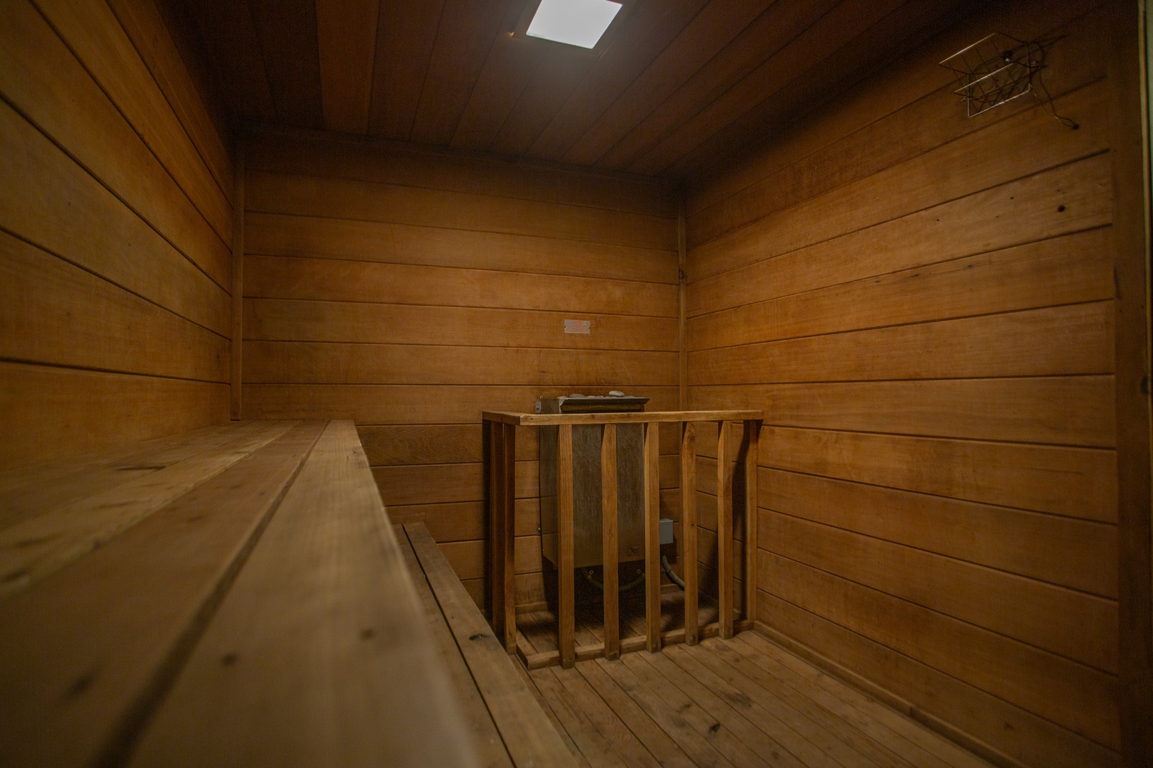 Step into your shared sauna where warm wood tones wrap around you. Settle onto the smooth benches, breathe in the gentle heat, and let the stress melt away from your muscles.