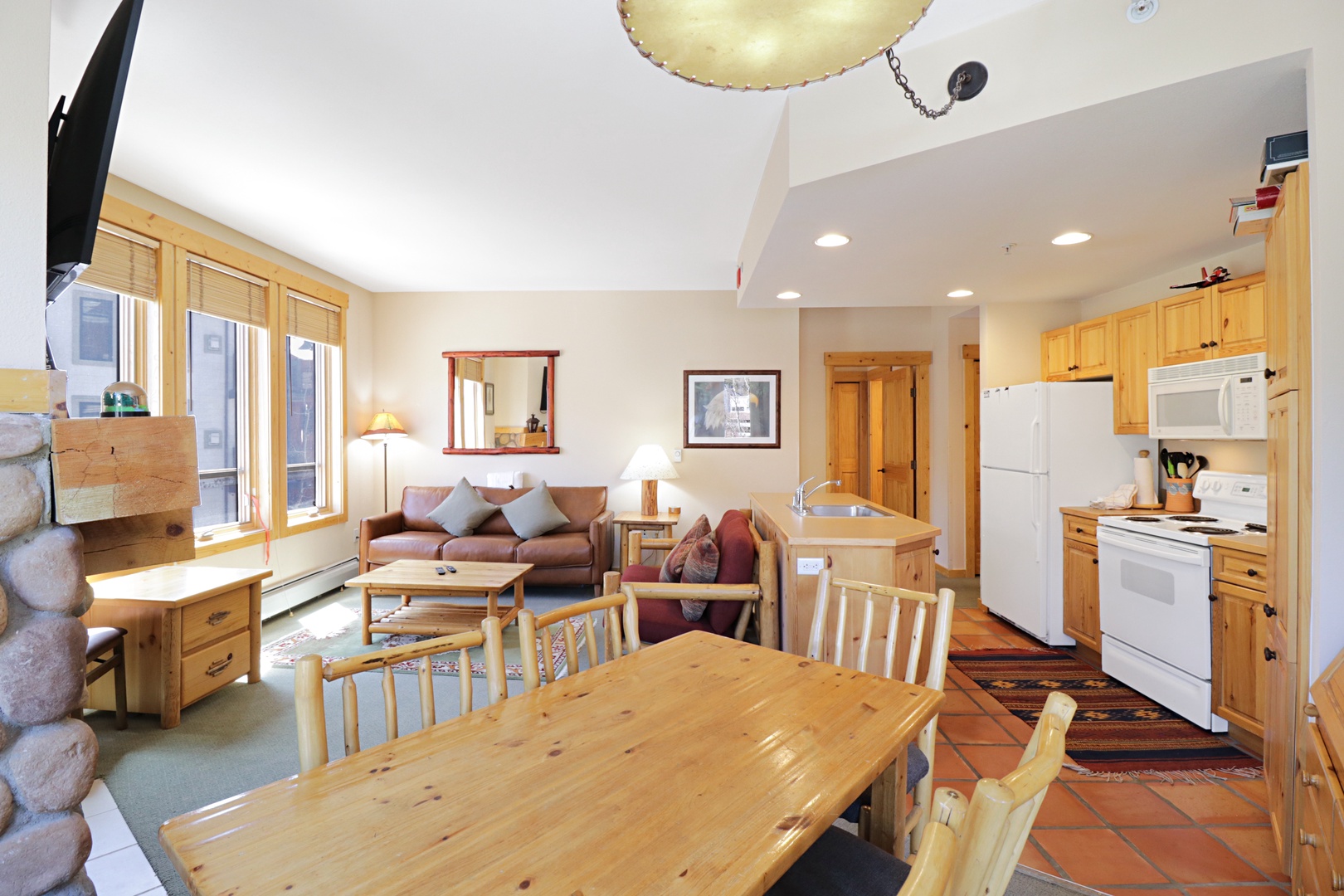 You'll love this spacious mountain retreat with warm wood finishes, full kitchen, and cozy living area perfect for gathering after adventures.
