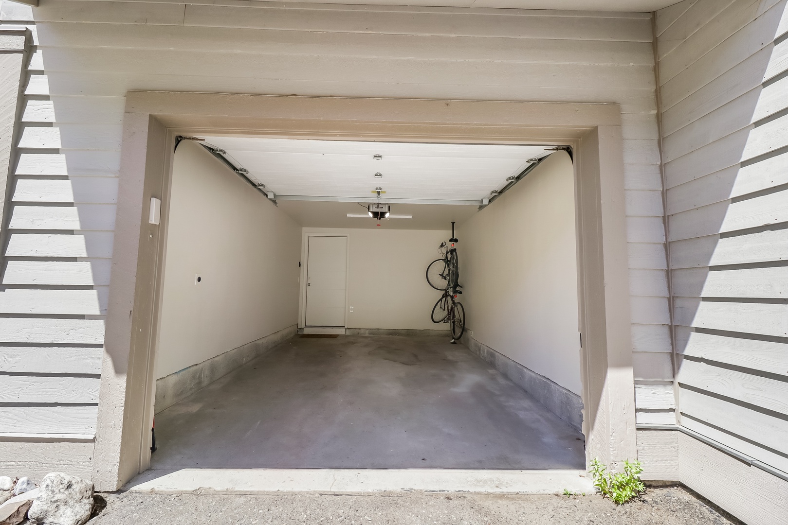 Secure garage parking awaits, with space for your vehicle and convenient bike storage inside.