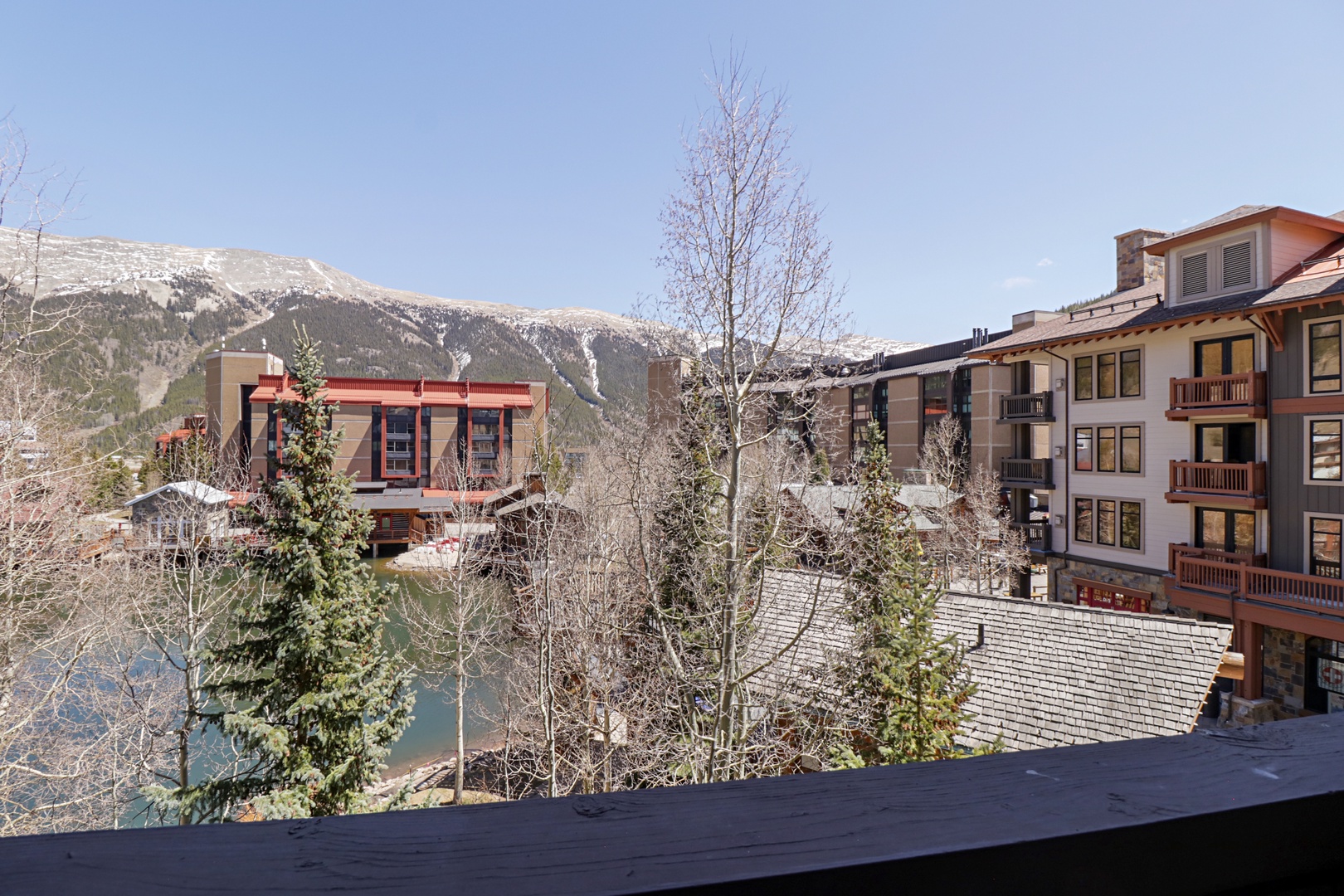 Scenic mountain village setting with snow-capped peaks and alpine architecture creating a picturesque backdrop for your mountain getaway.