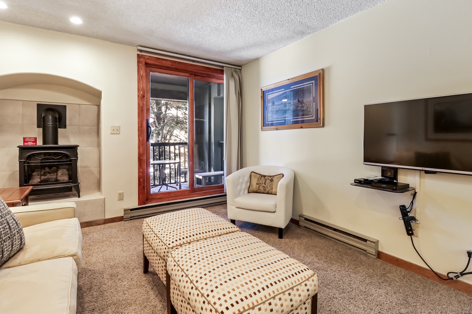 Cozy up by your private fireplace while enjoying mountain views through sliding doors to your balcony.