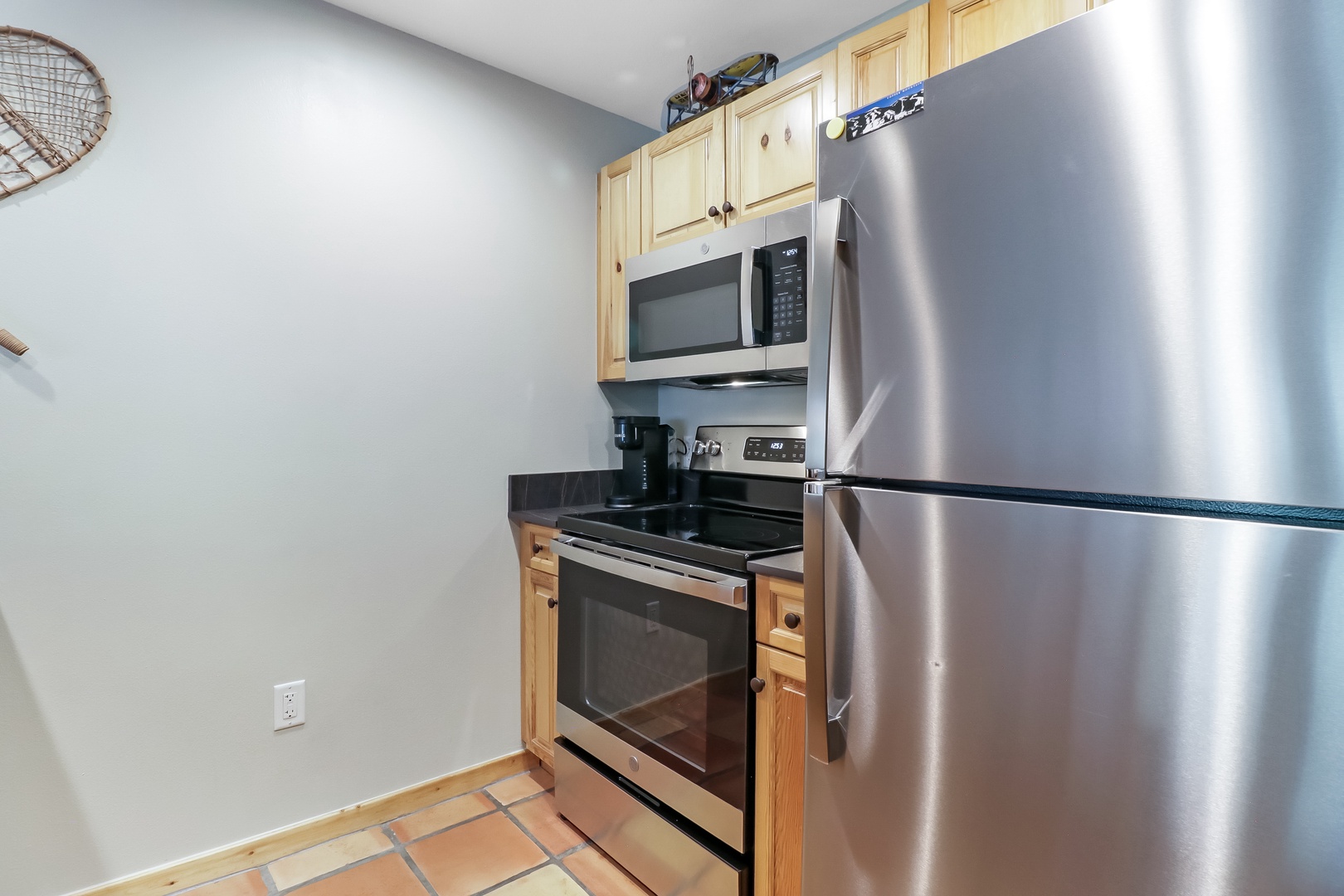 Your fully equipped kitchen features stainless appliances and warm wood cabinetry, making it easy to prepare your favorite meals during your stay.