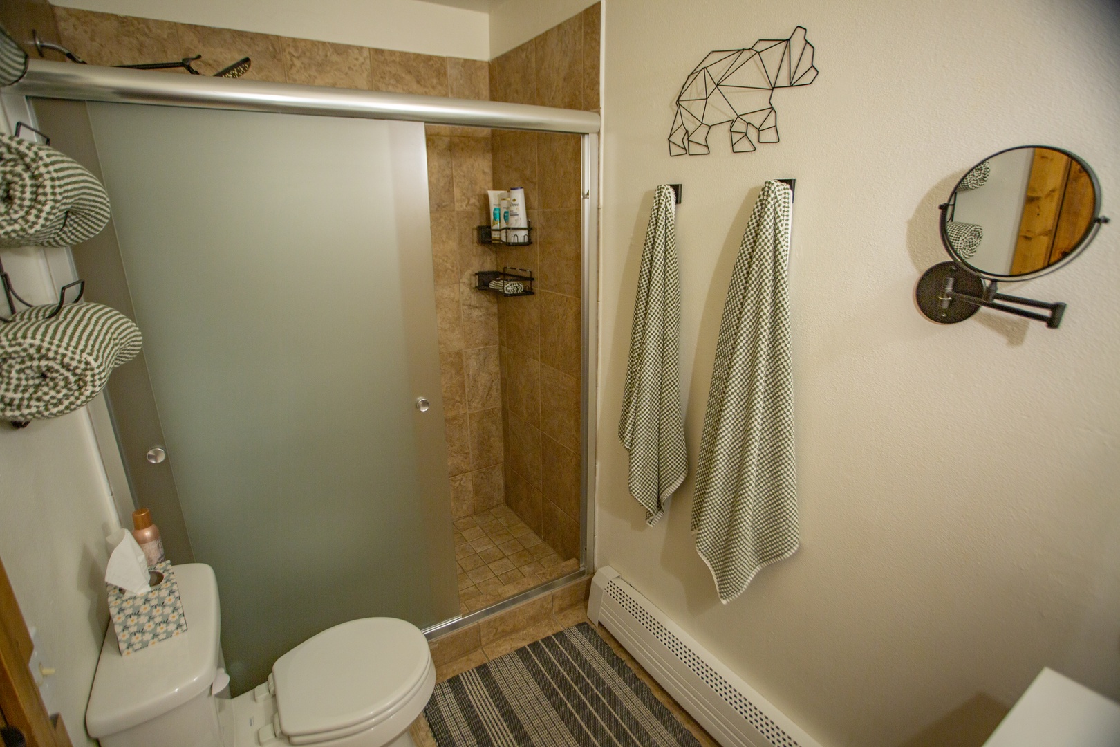 Step into your private bathroom with a relaxing walk-in shower, complete with fresh towels and thoughtful touches to make you feel right at home.