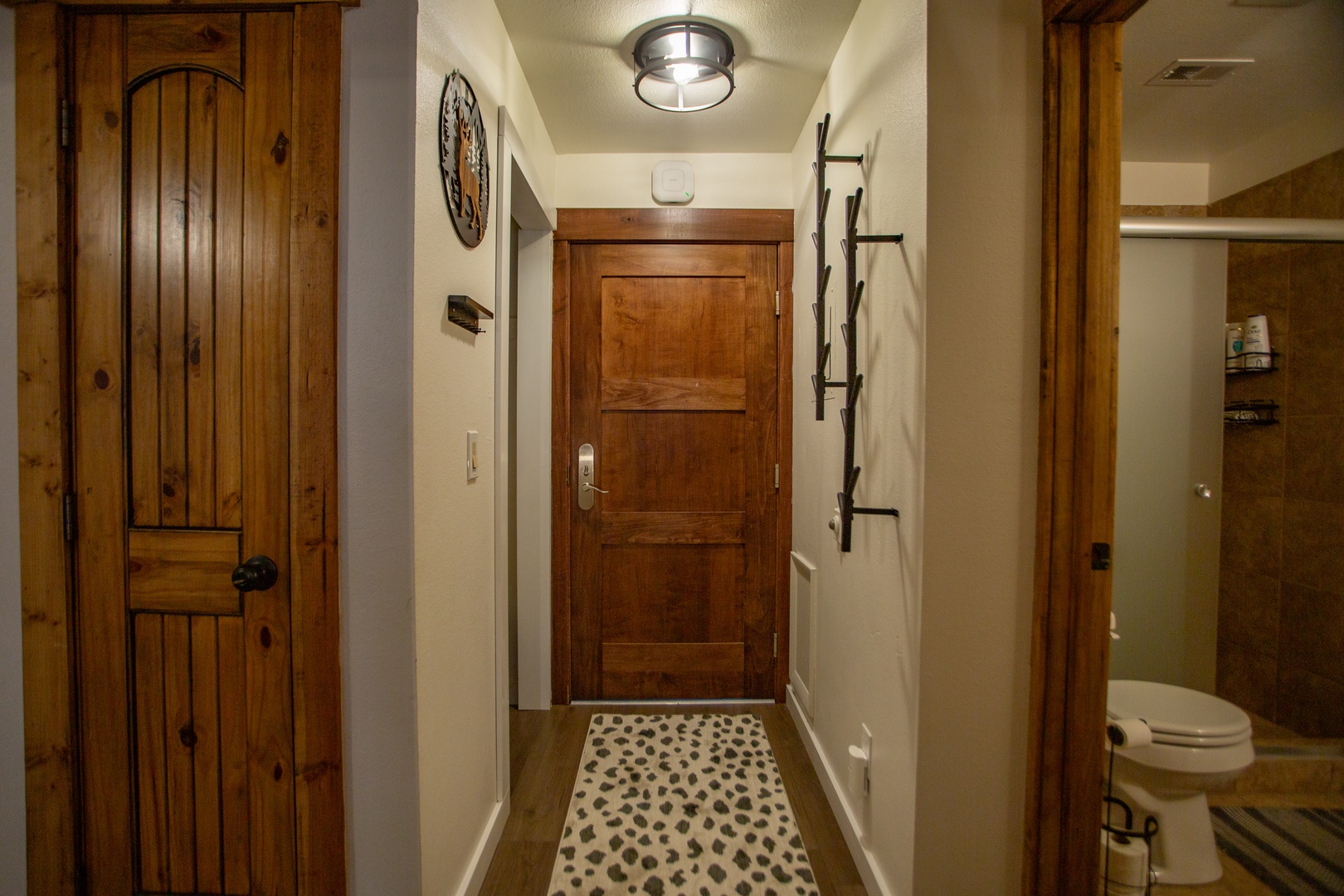 Your welcoming entryway sets a cozy mountain retreat tone with warm wood accents, rustic touches, and natural charm—inviting you in from the moment you arrive.