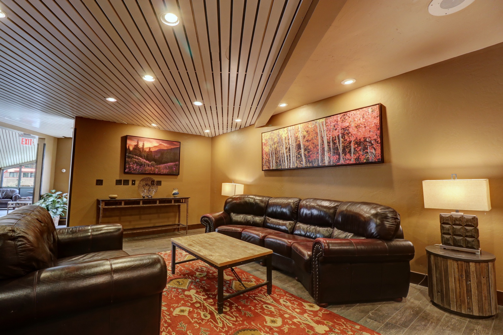 Sink into plush leather seating in this warm, inviting lounge. Rich wood tones and thoughtful decor create the perfect retreat to relax and unwind.