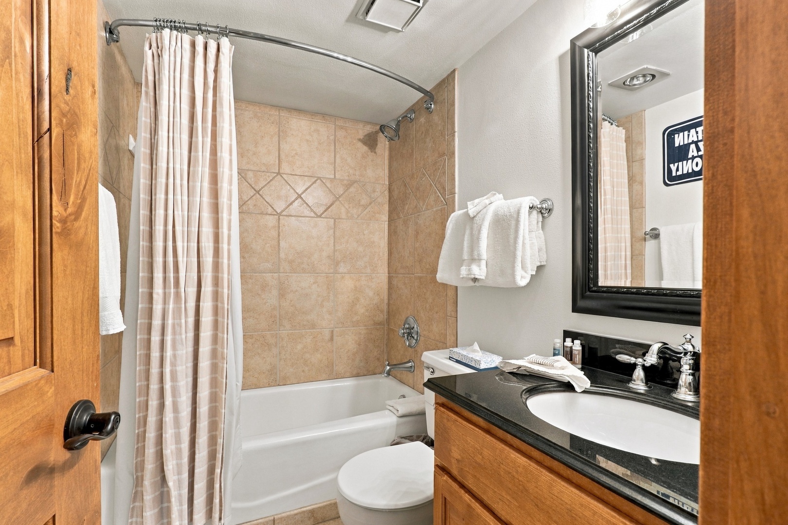 Freshen up in your well-appointed bathroom with a tub-shower combo, crisp towels, and modern fixtures waiting for you after a day of mountain adventures.