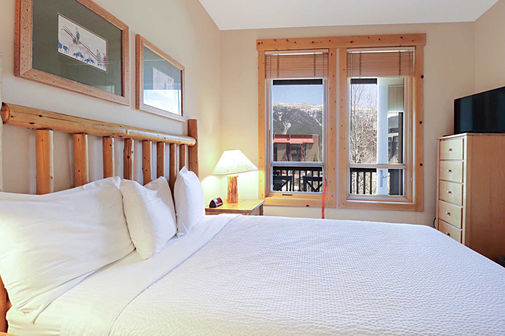 Wake to stunning mountain vistas through your large windows, where rustic charm meets comfort in this cozy retreat.