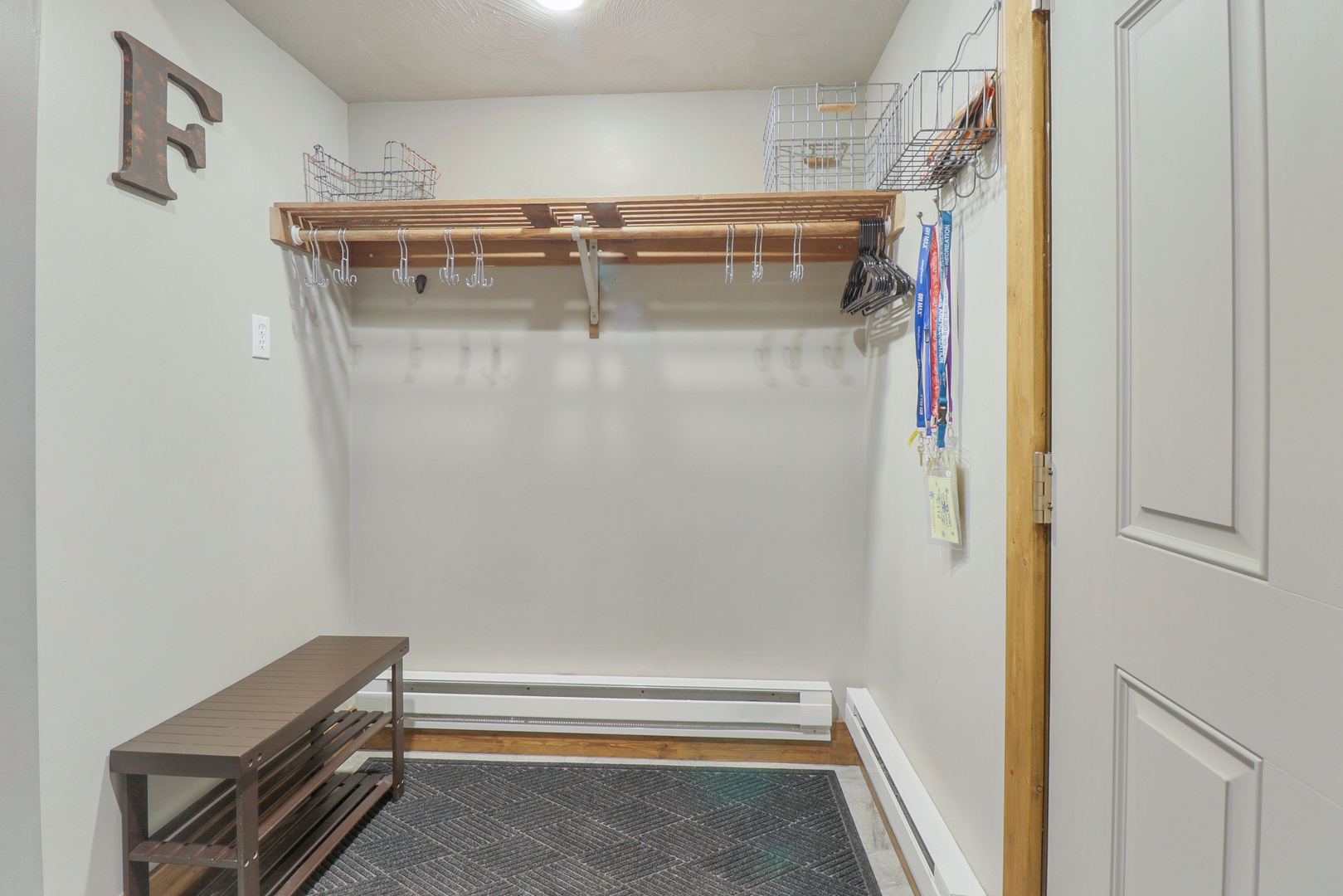 Your own private walk-in closet awaits, complete with custom wood shelving and plenty of hanging space to keep your wardrobe organized during your stay.