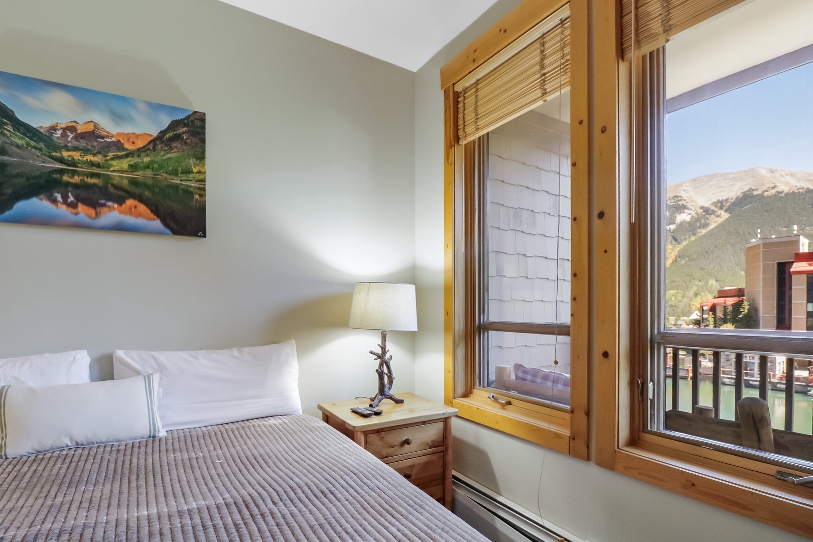 Your cozy mountain retreat awaits—wake up to crisp alpine views, soft linens, and peaceful mornings framed by towering peaks right outside your window.