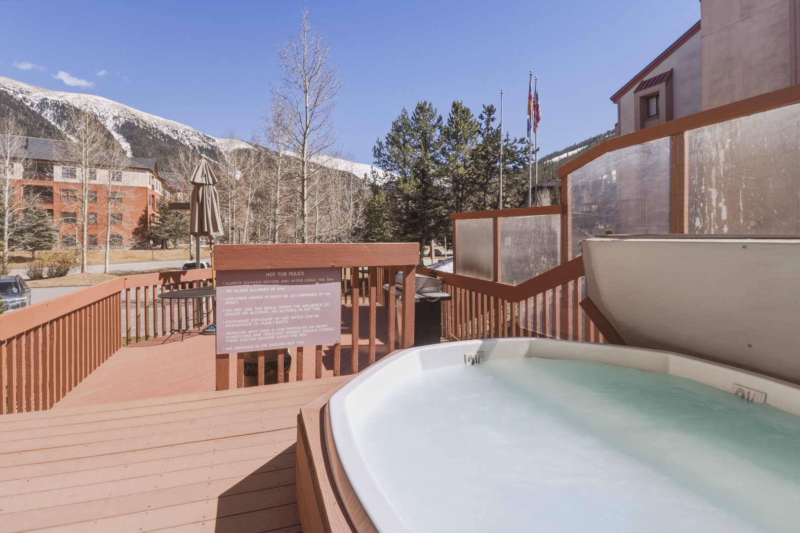 Soak in bubbling warmth while gazing at snow-capped peaks from your private hot tub oasis.