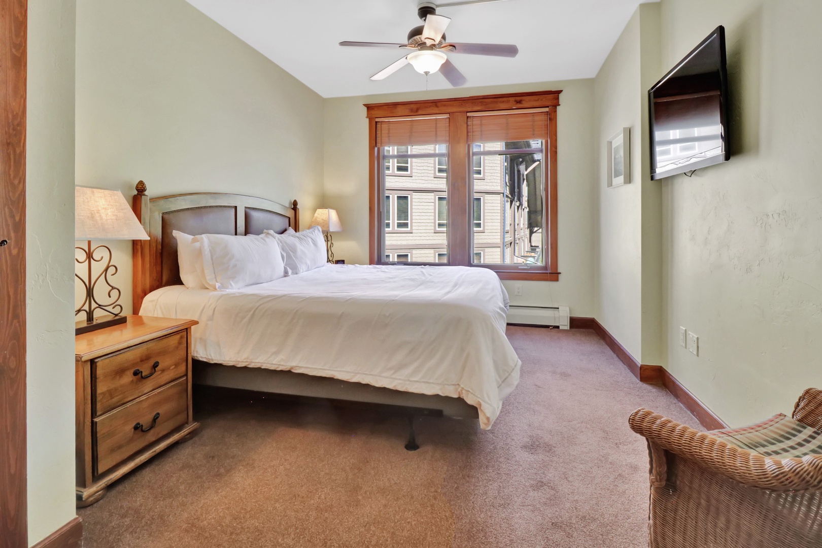 Sink into crisp linens in your peaceful bedroom retreat. The plush bed and soft lighting create a restful haven where you can unwind after a day of mountain adventures.