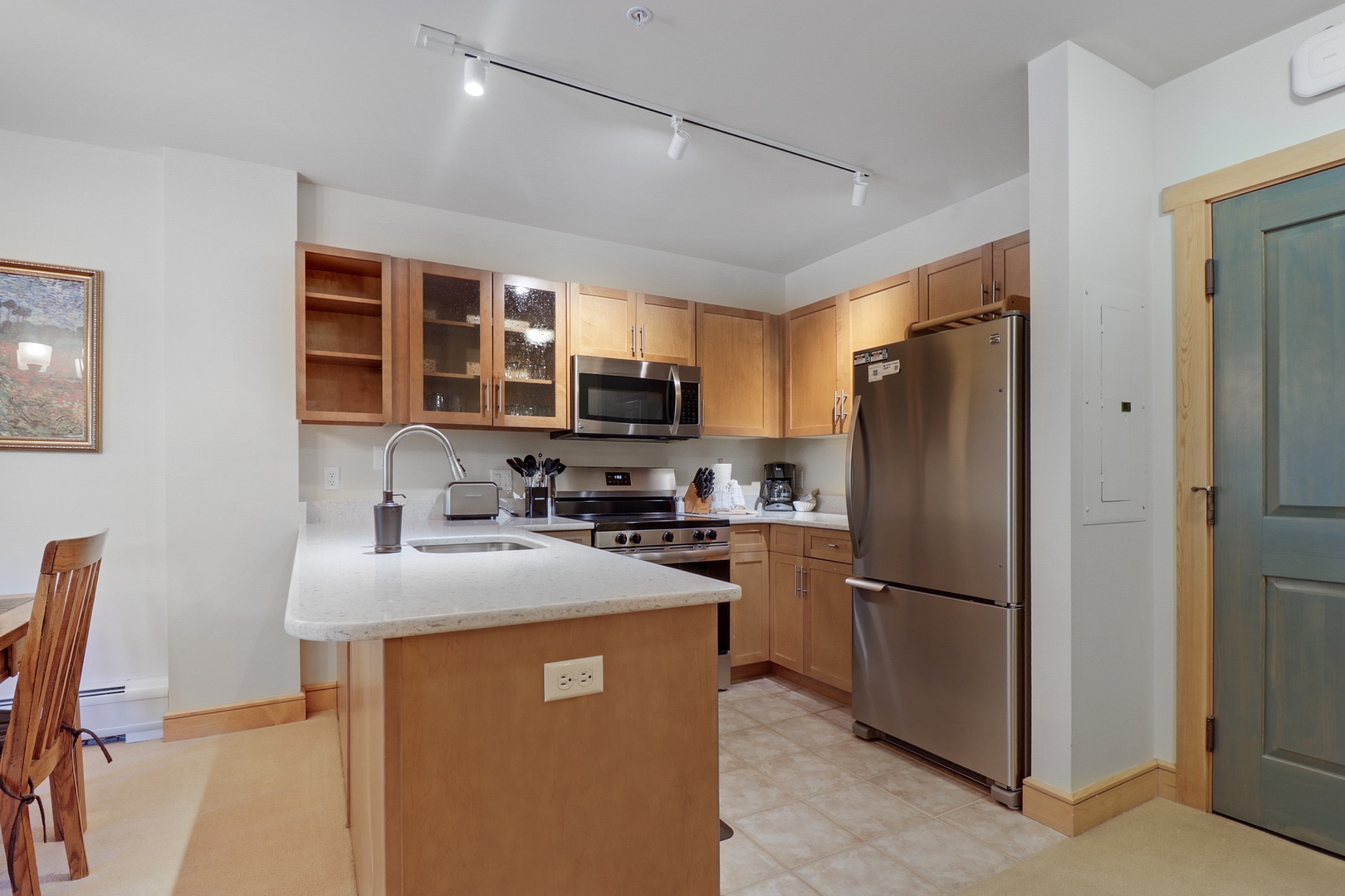 Your fully equipped kitchen awaits with modern appliances, ample counter space, and everything you need to prepare your favorite meals in comfort and style.