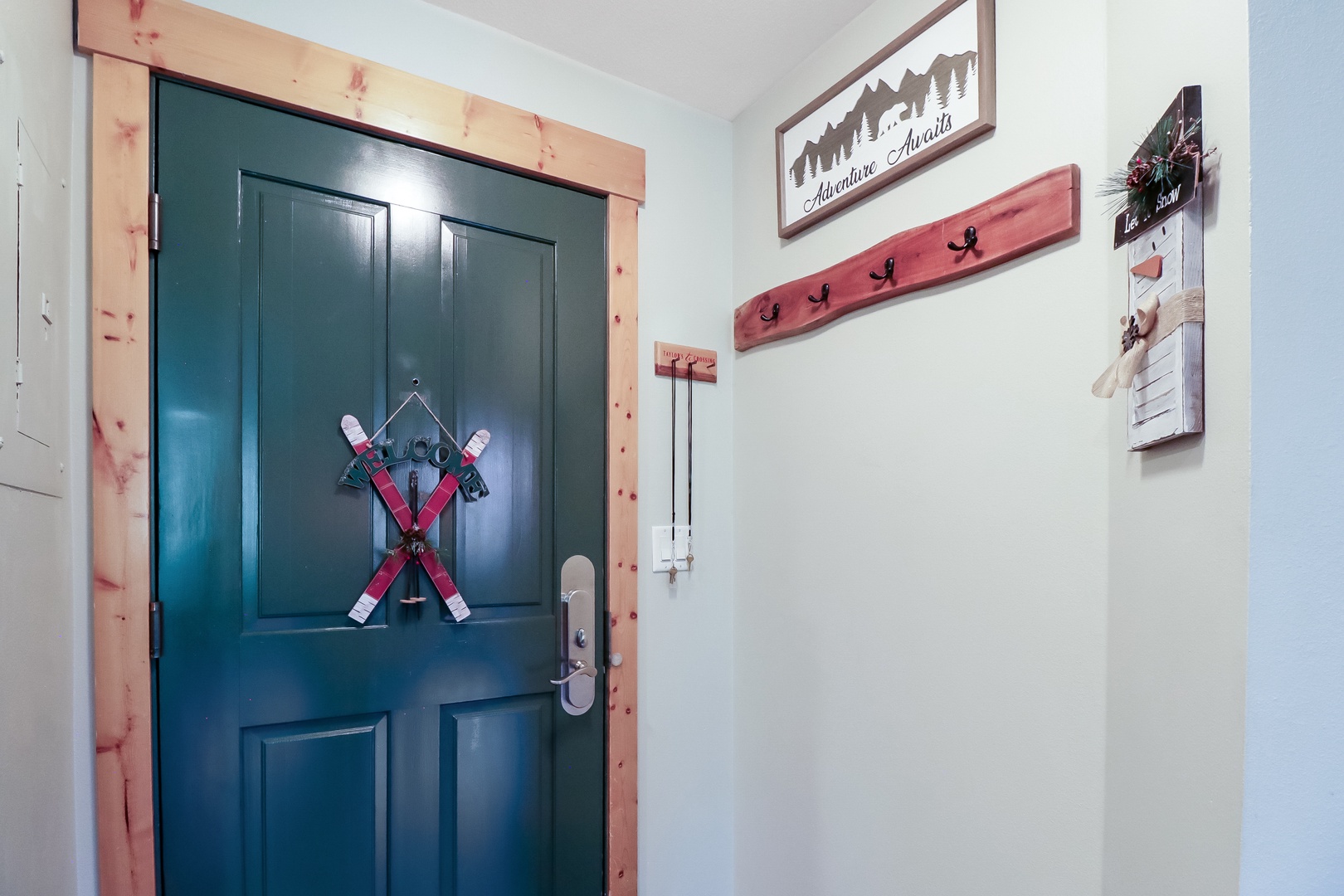 The welcoming entrance features rustic mountain-inspired décor and thoughtful ski-themed touches that set the tone for your alpine getaway.