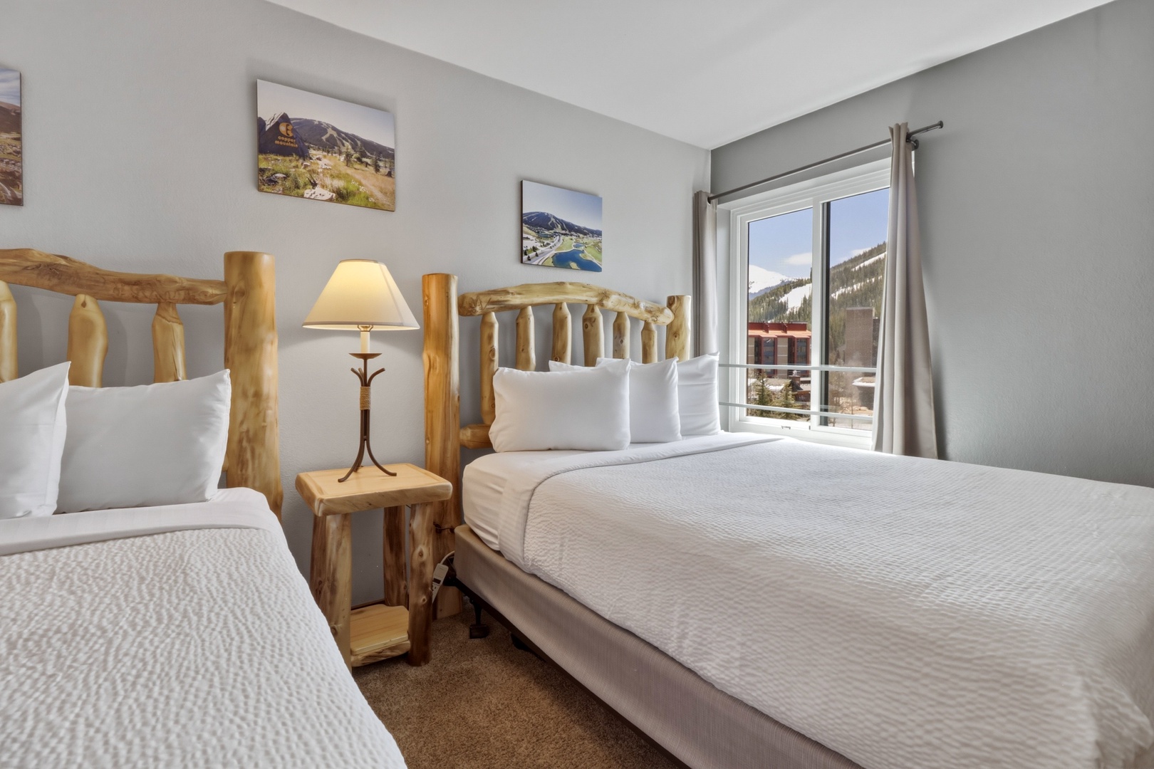 Rest peacefully in your cozy bedroom with rustic log furniture, crisp linens, and mountain views through your window.