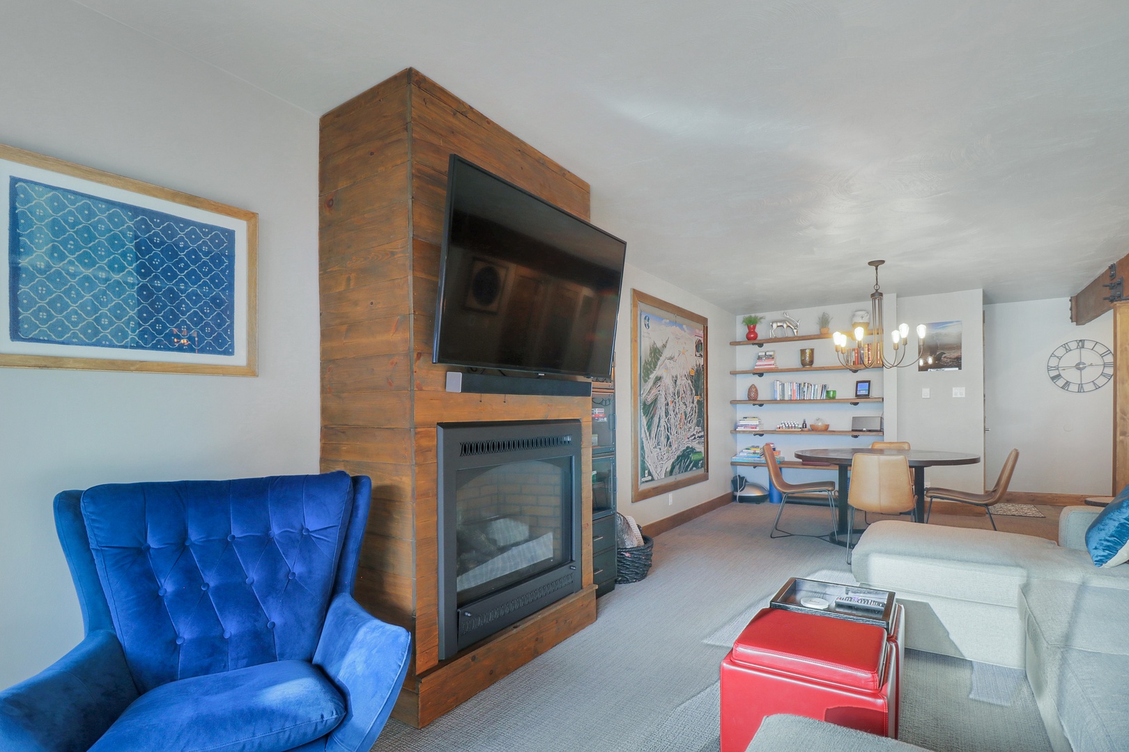 Settle into your stylish living space where modern comfort meets mountain charm. Cozy up by the fireplace with a good book, enjoy movie nights on the flat-screen TV, or gather around the dining table for memorable meals together.