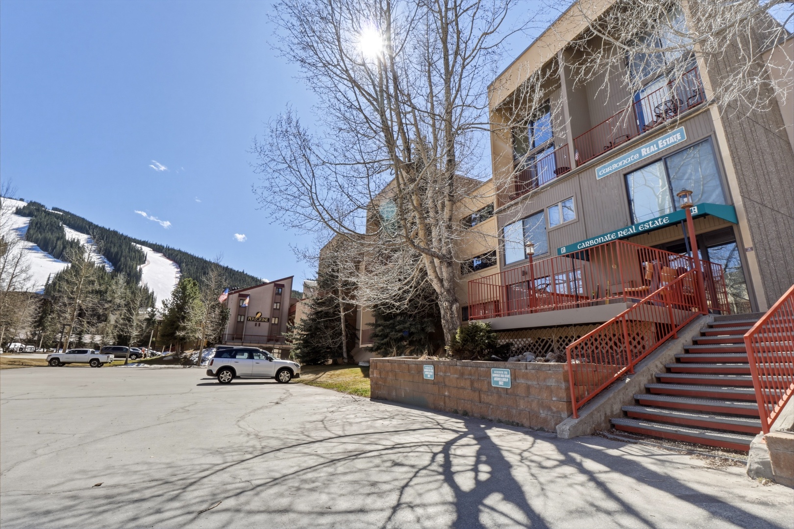 Mountain resort property with convenient parking and easy access to nearby slopes and amenities.