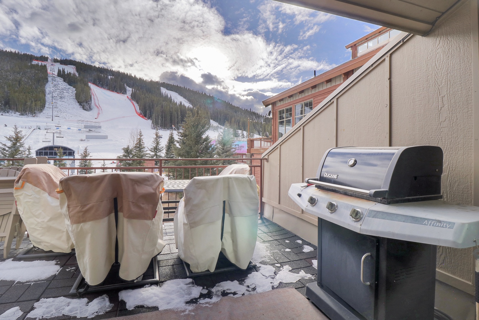 Your private mountain terrace awaits with a premium BBQ grill and stunning ski slope views. Picture yourself grilling dinner while watching skiers glide down the pristine runs.