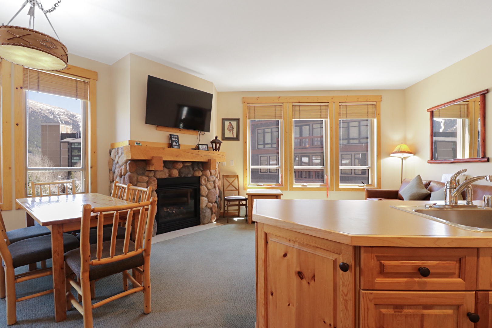 Cozy mountain retreat with stone fireplace, full kitchen, and dining space where you'll create memories over home-cooked meals.
