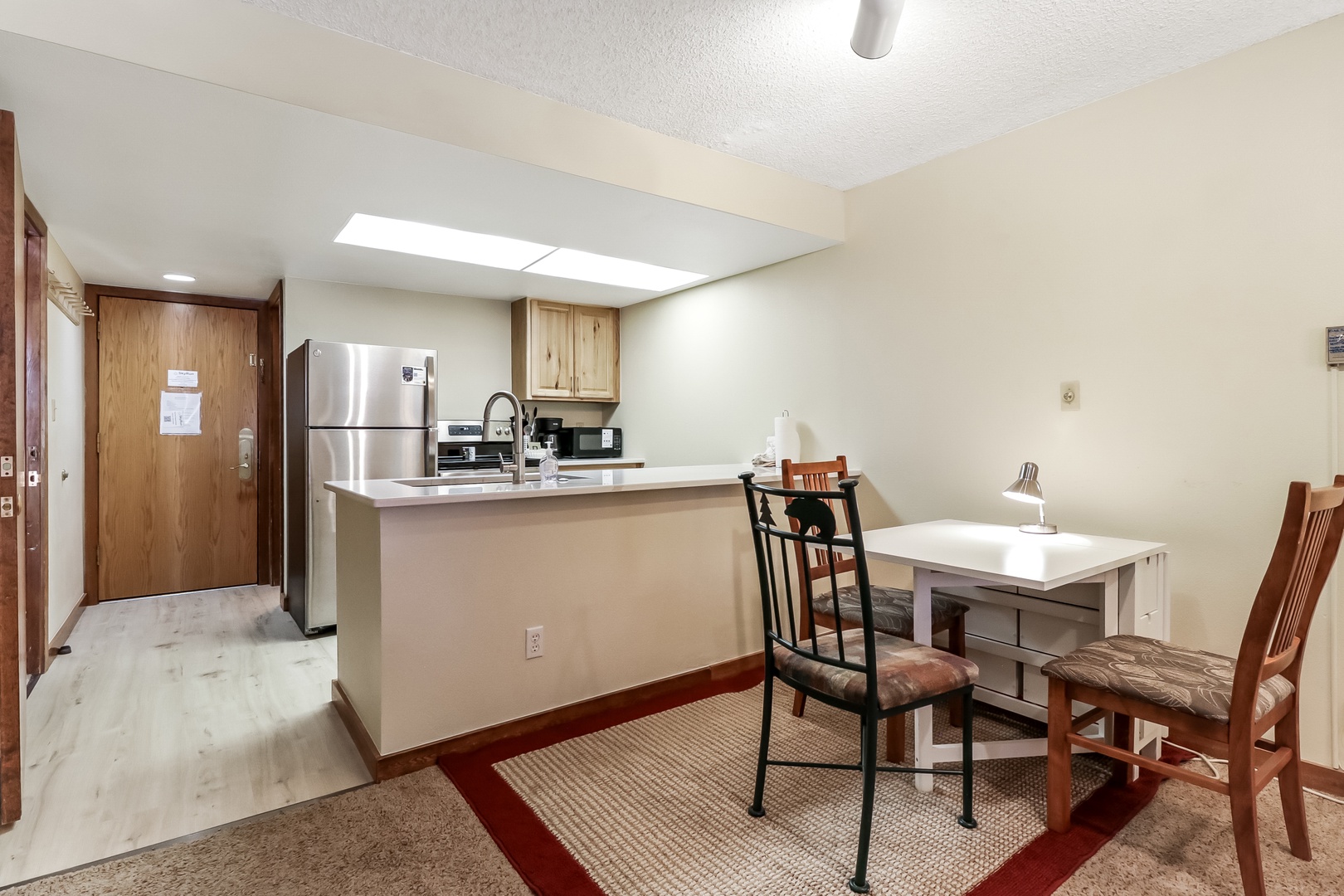 Your fully equipped kitchen and dining space features modern appliances and comfortable seating for memorable meals during your stay.