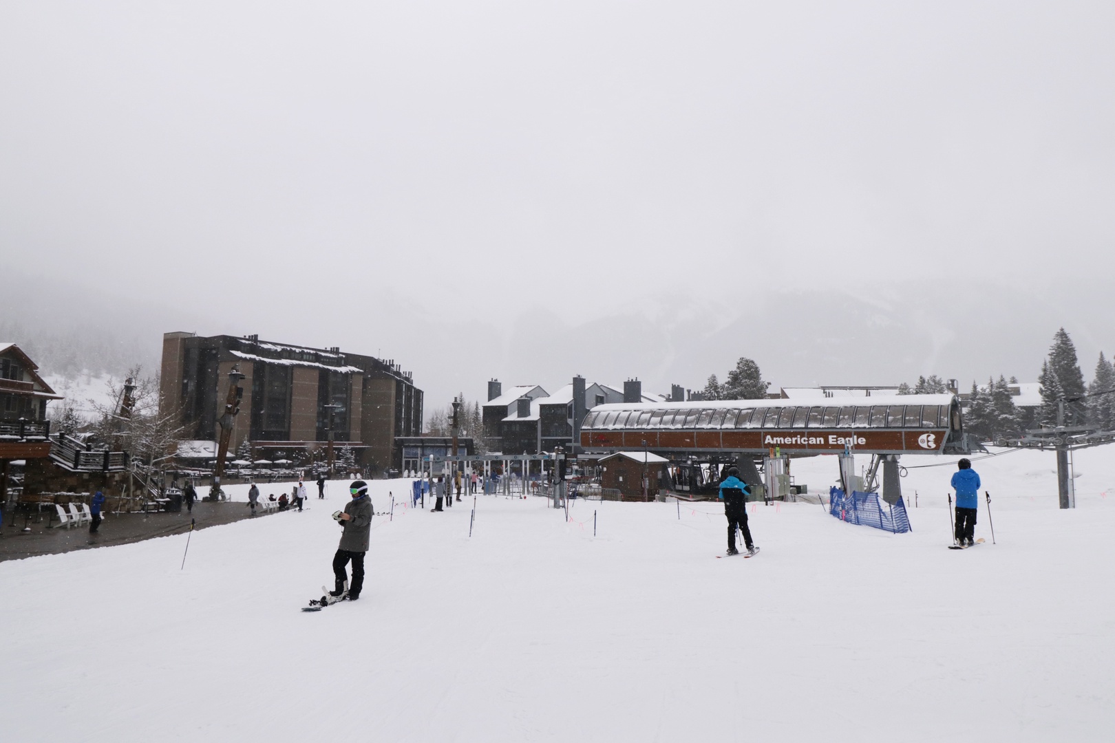 Fresh powder blankets the base area of this popular ski resort, with the American Eagle lift ready to whisk skiers and snowboarders up the mountain. Winter adventures await in this scenic alpine village.