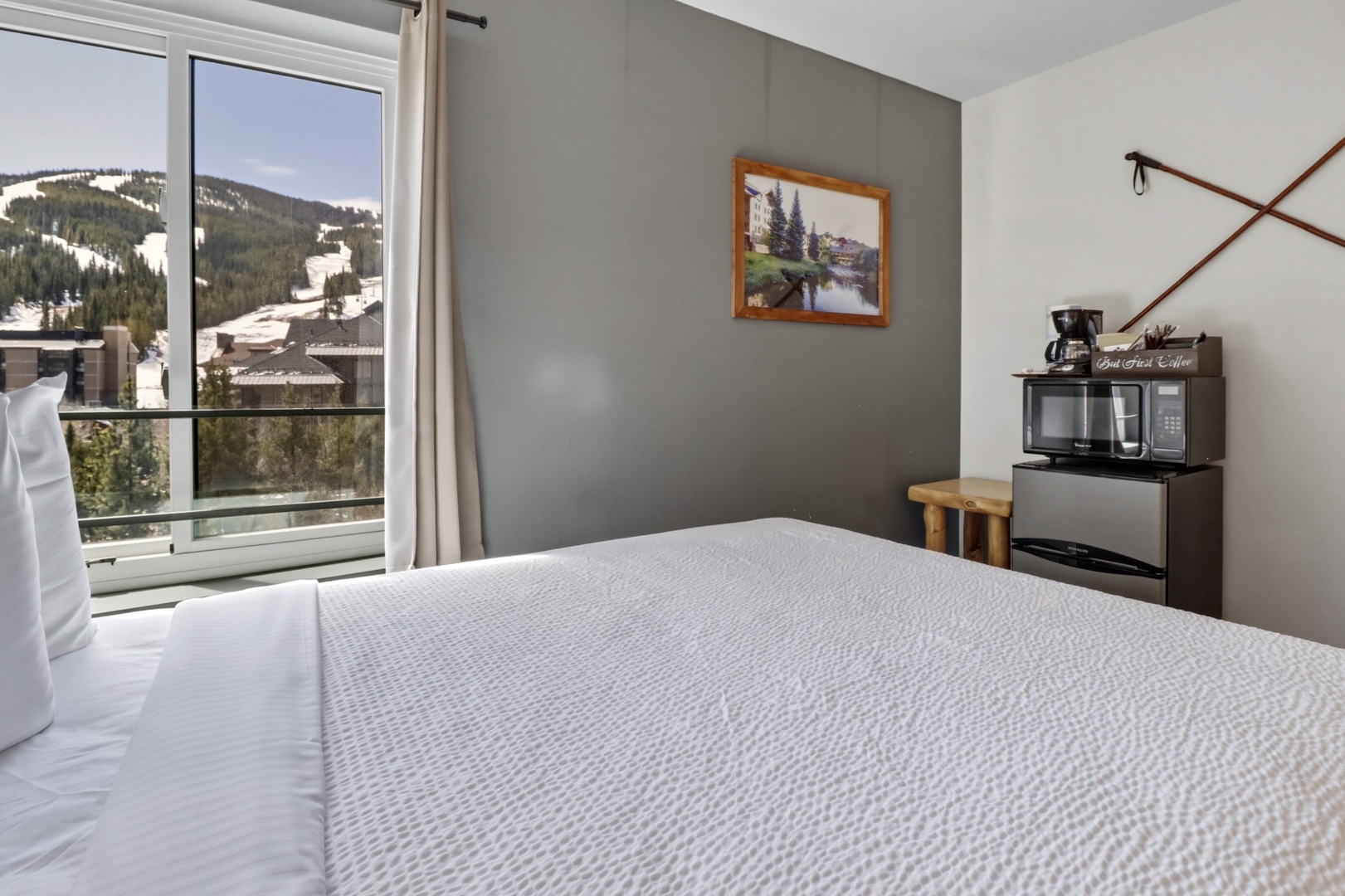 Wake up to stunning mountain views from your cozy bedroom, complete with modern amenities and fresh coffee.
