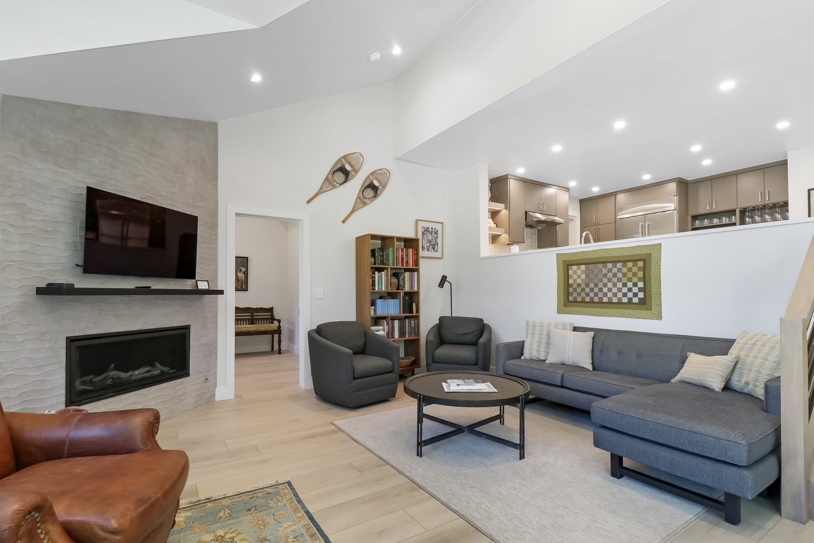 Sink into the plush sofa after a day of exploring, with a cozy fireplace warming the room and an open kitchen inviting you to whip up your favorite meals.