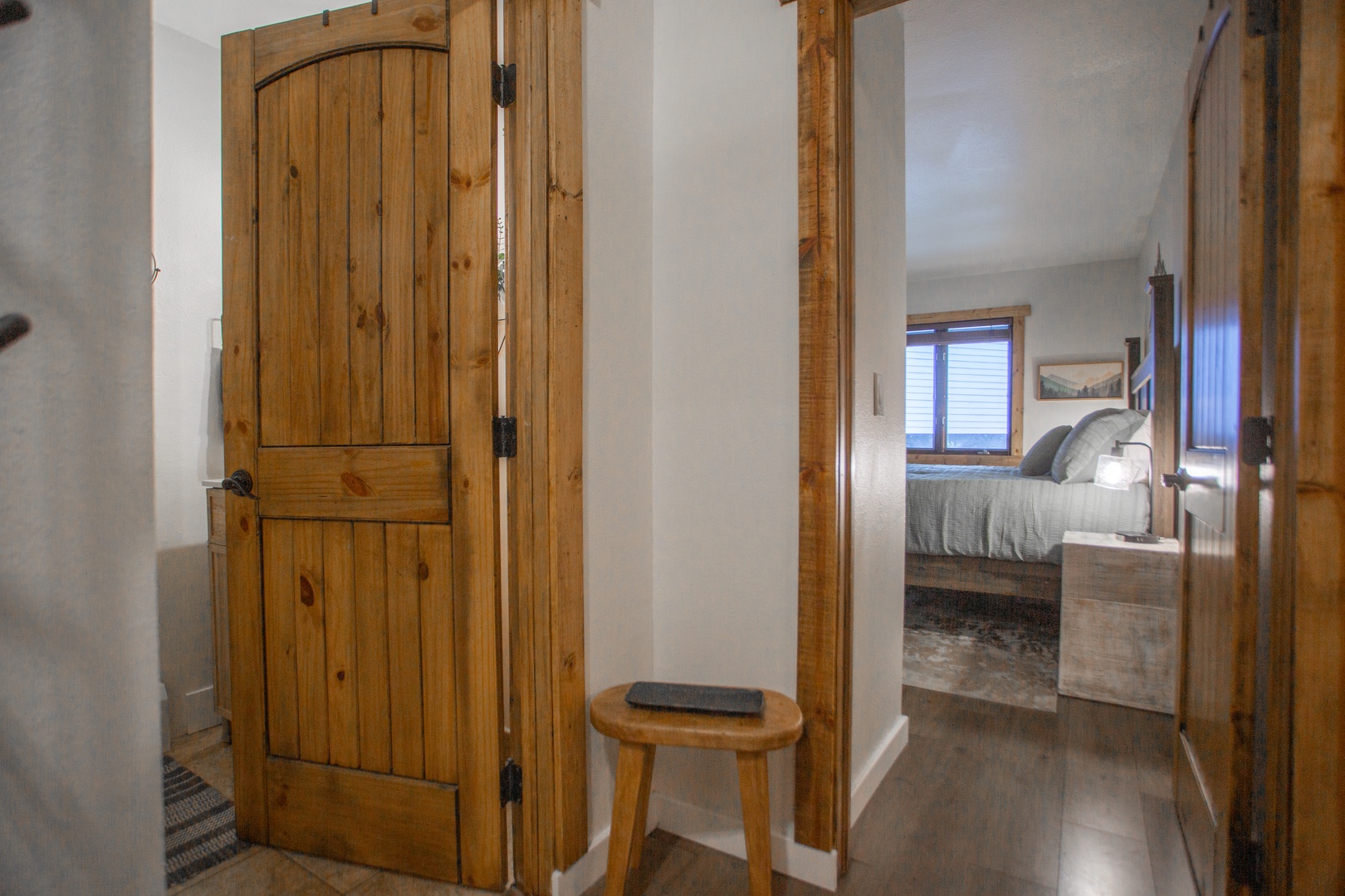 Step through charming rustic doors into your private retreat, where warm wood accents and thoughtful design create a welcoming mountain escape that feels like home.