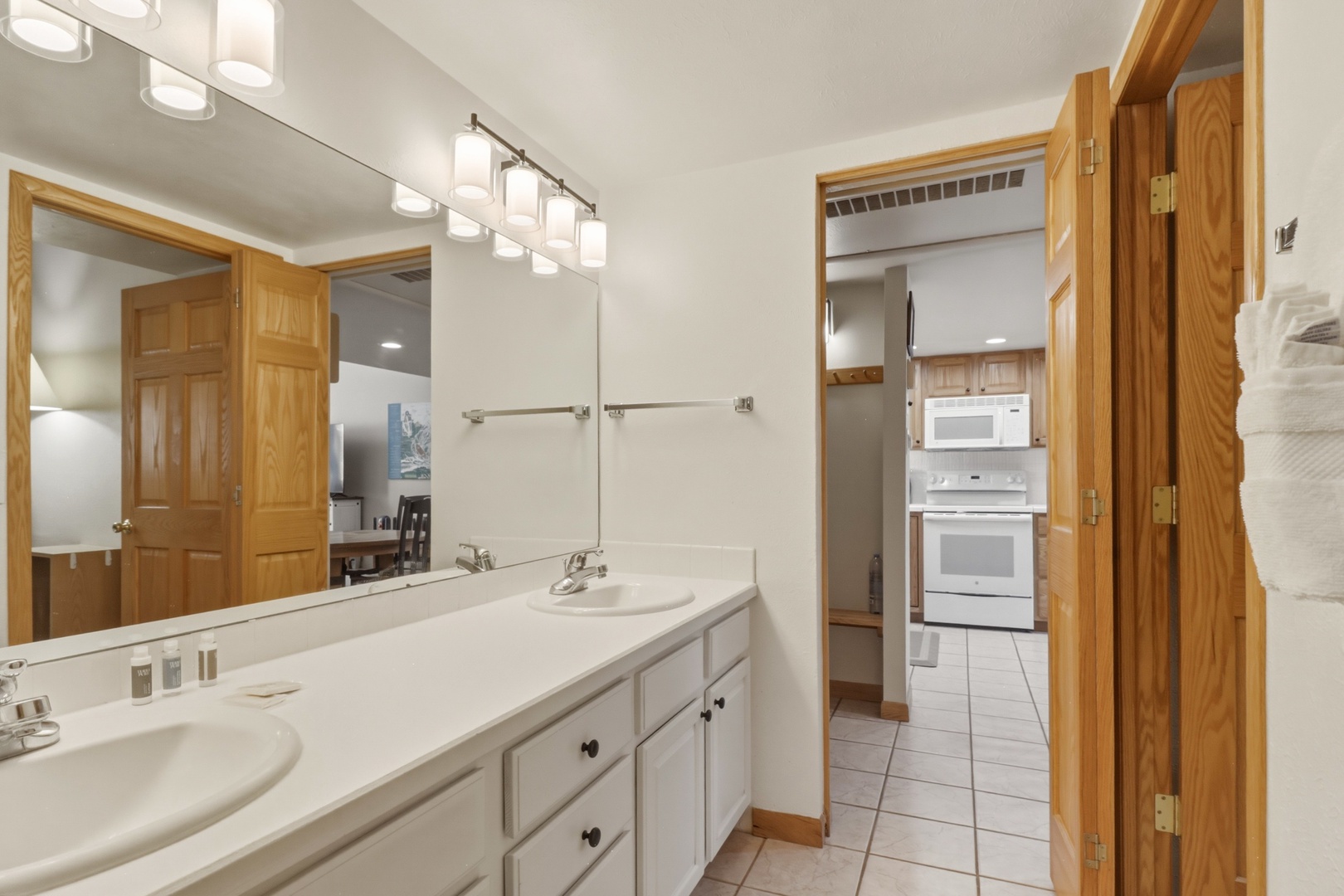 Refresh in your bright, dual-vanity bathroom with warm wood accents and convenient closet space for all your belongings.