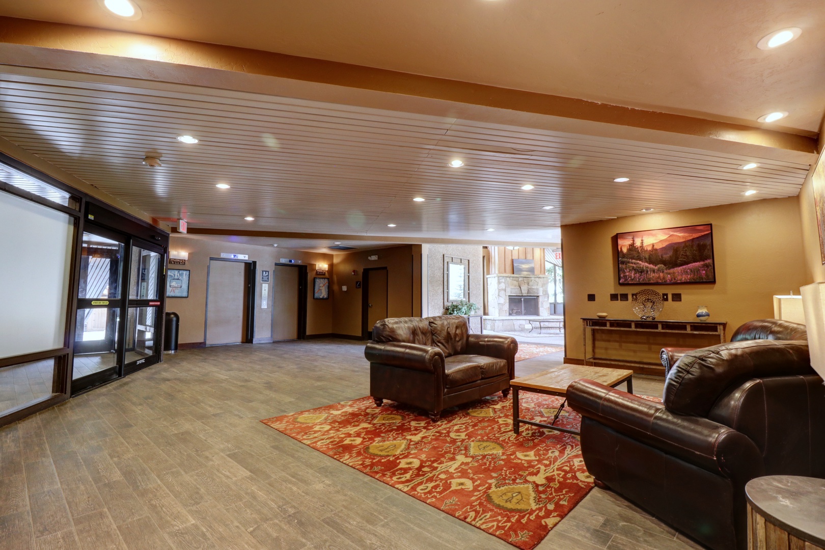 Relax into comfortable leather chairs in your welcoming lobby, where warm lighting and tasteful decor create an inviting first impression the moment you arrive.