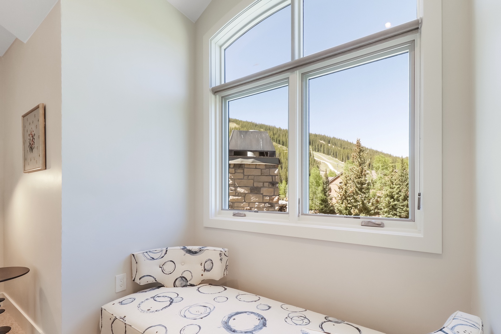 Relax in this cozy nook with mountain views, where you can unwind with a book or simply soak in the serene forest landscape.