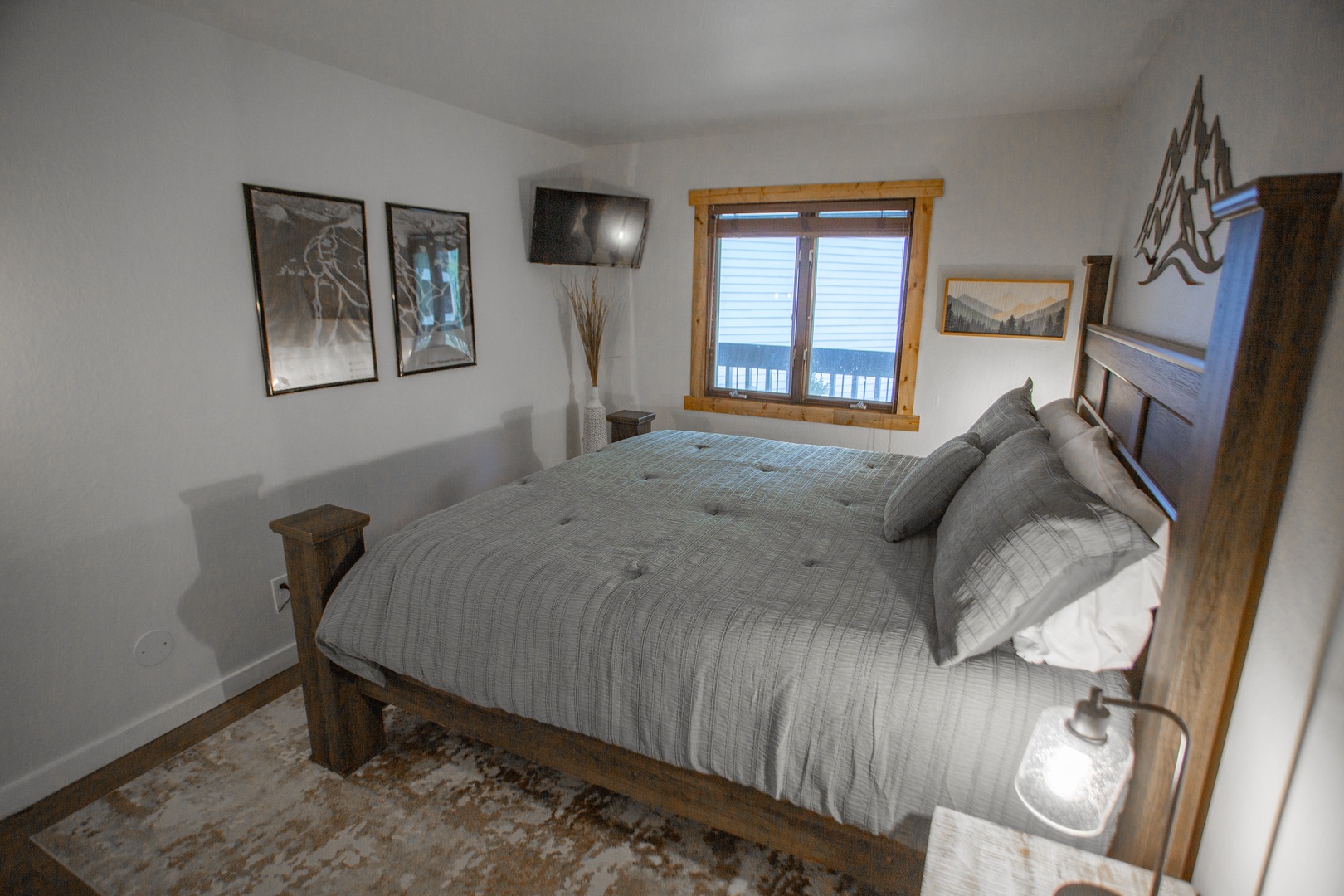 Wake up to serene ocean views right from your bed. This cozy bedroom features rustic wooden furnishings and a calming palette that invites restful nights.