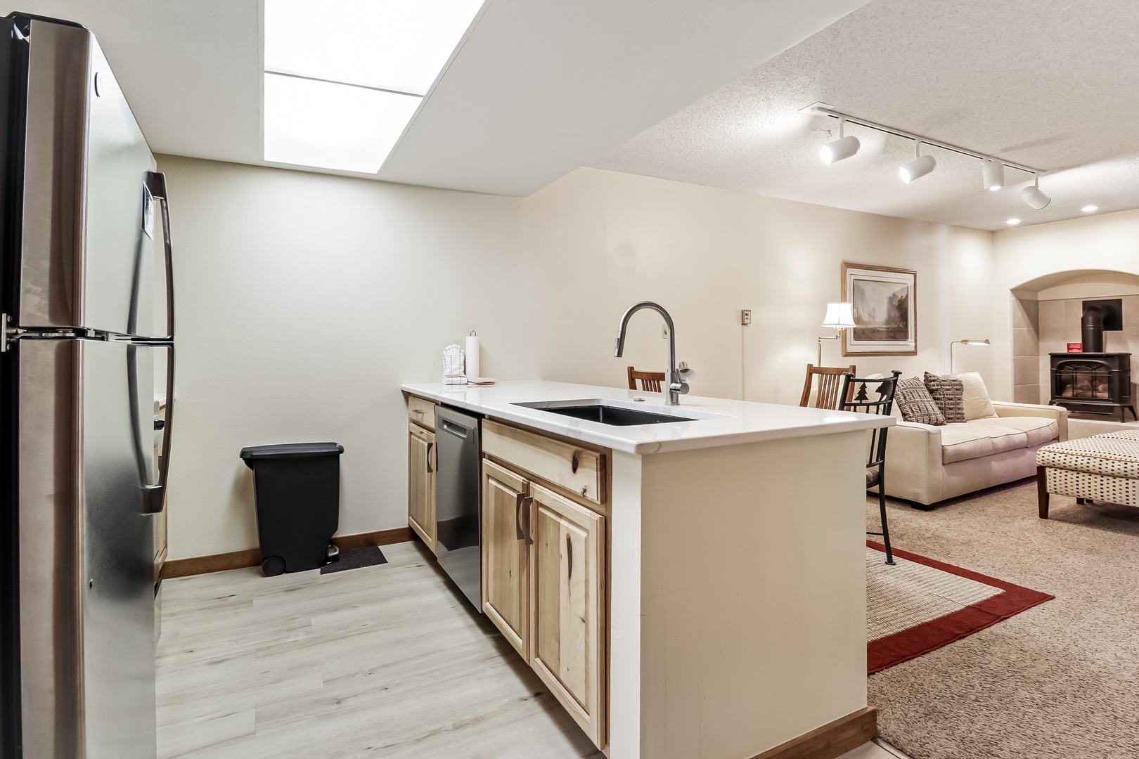 Your open-concept kitchen flows seamlessly into the living area, creating perfect spaces for cooking and relaxing together.