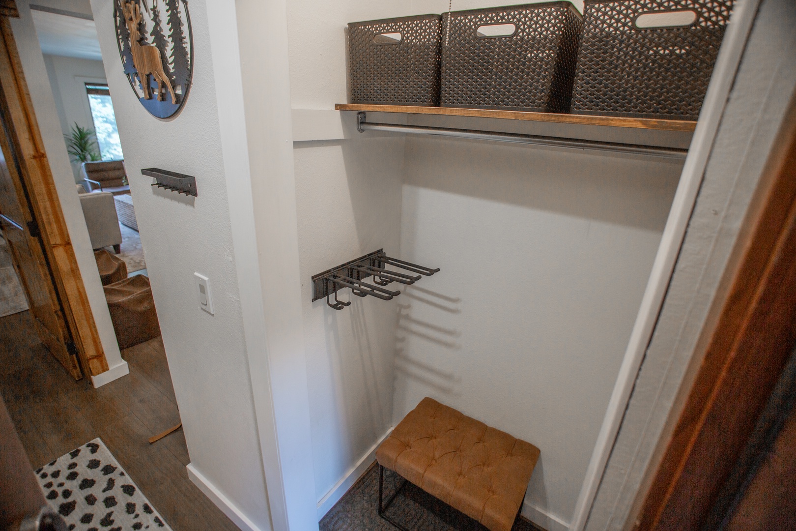 Your dedicated storage closet keeps everything organized with hooks for gear and upper shelving—perfect for stowing away sports equipment, luggage, or mountain essentials while you unwind.