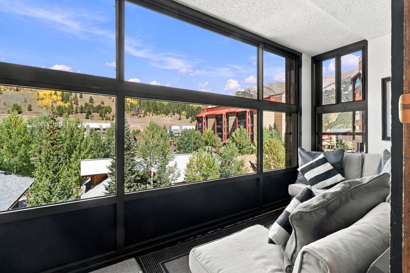 Sink into plush seating and soak in sweeping mountain views framed by expansive windows—your front-row seat to alpine beauty and golden aspens.