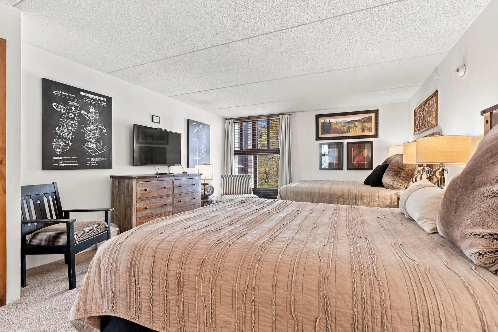 Unwind in your cozy bedroom, where two plush beds promise restful nights and warm mountain mornings await just outside your window.