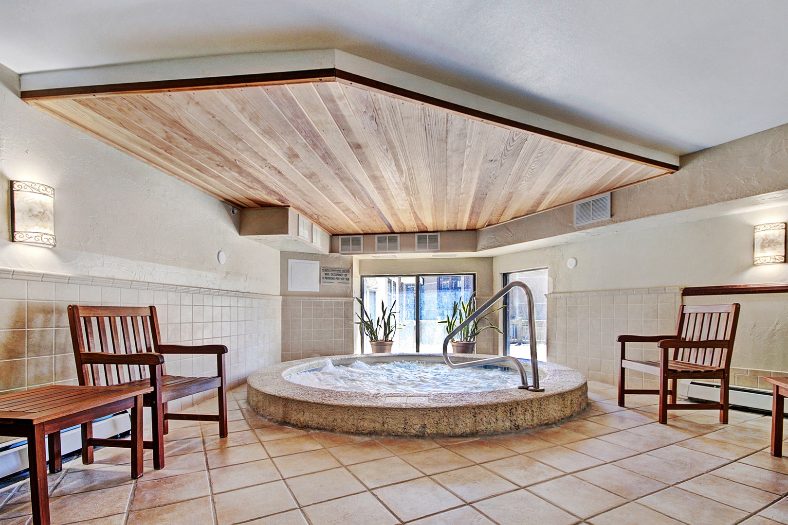 Slip into the soothing hot tub beneath a stunning wood canopy, unwind in a comfortable chair, and let the stress of travel melt away in your own wellness retreat.