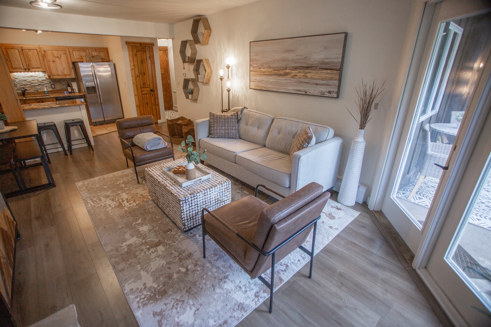 Unwind in your thoughtfully designed living space, where warm wood tones and plush seating invite you to kick back after a day of adventure. The open layout connects you to the kitchen, perfect for cozy evenings in.
