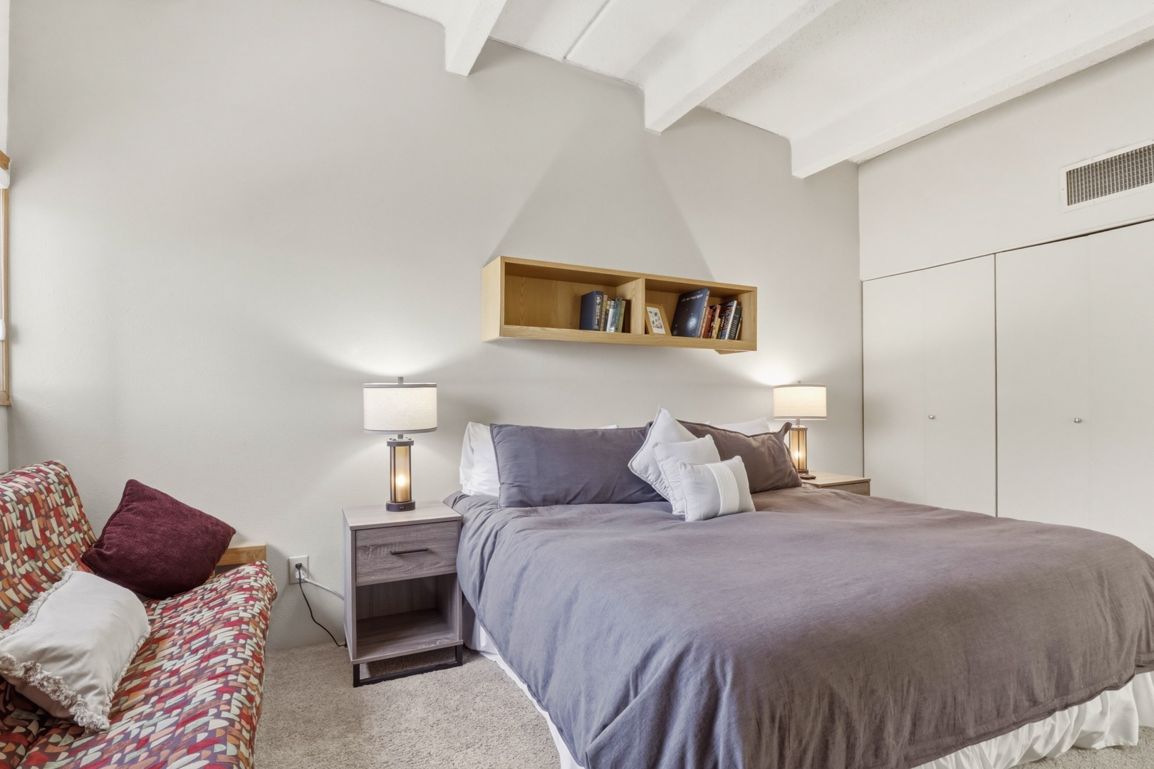 Your serene bedroom retreat features warm wood accents and soft lighting, perfect for unwinding after exploring.