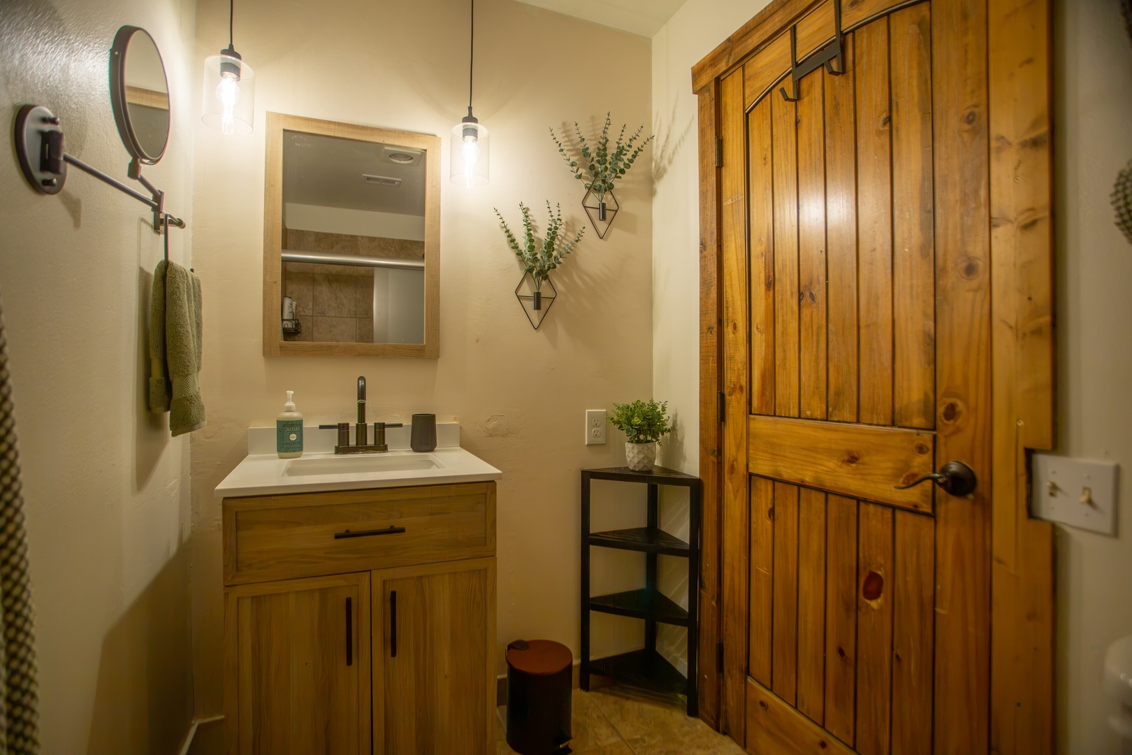 Your private bathroom features warm wood tones and thoughtful touches, creating a cozy retreat where you can freshen up in style and comfort.