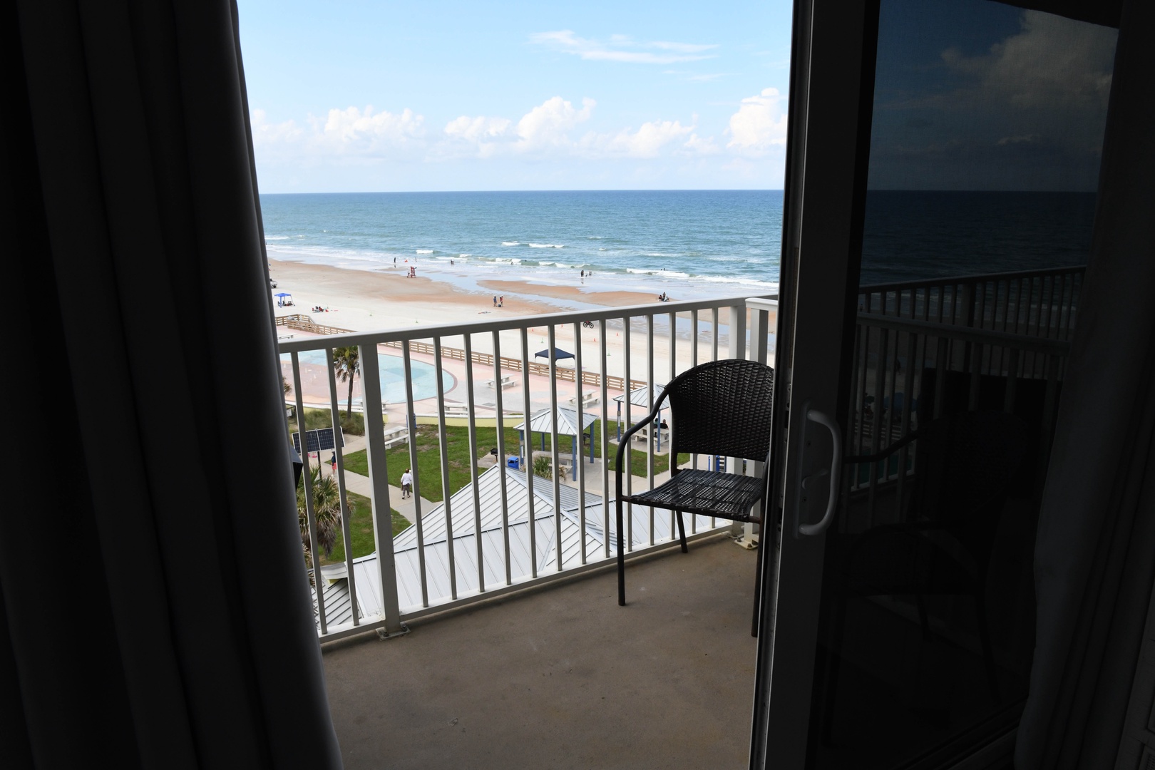 Step out onto your private balcony and take in sweeping ocean and beach views, with gentle waves and soft sand just moments away—your perfect coastal retreat awaits.