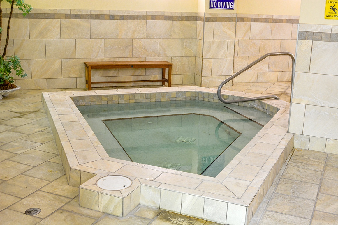 Slip into warm bubbling waters and let your stress melt away in this inviting hot tub, perfectly positioned for ultimate relaxation.