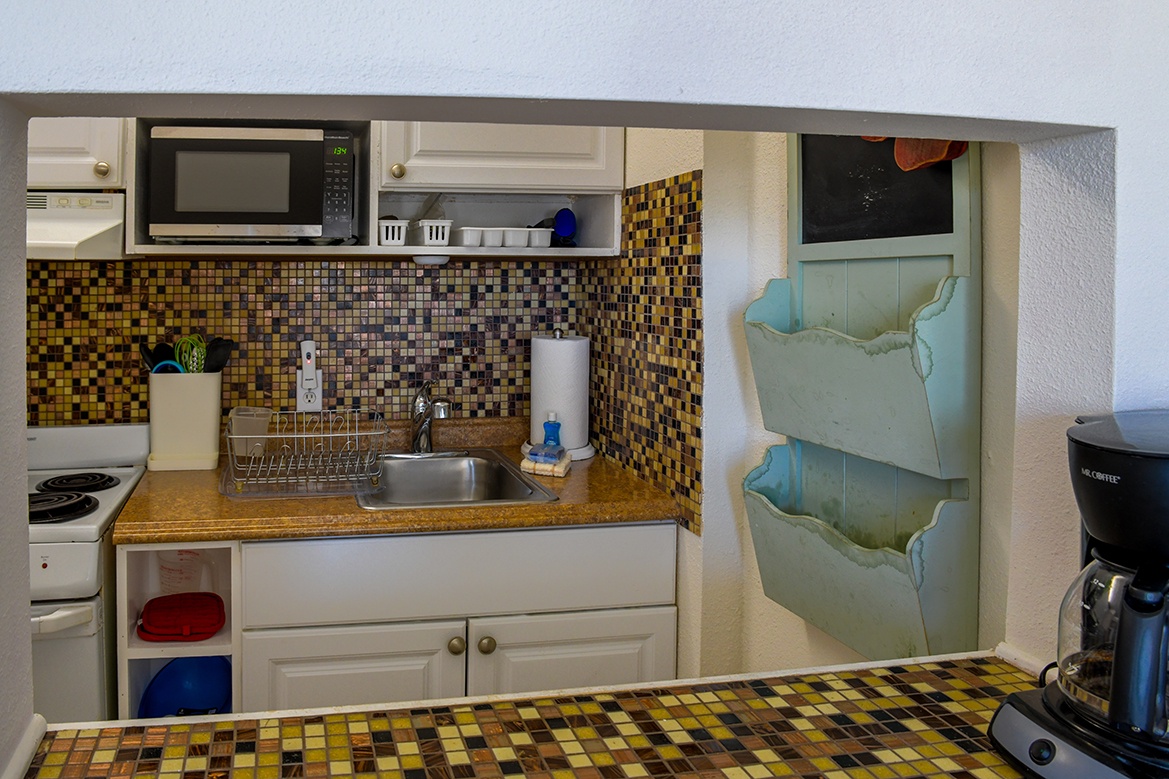 Your compact kitchen features mosaic tile details and everything you need to prepare meals during your stay.
