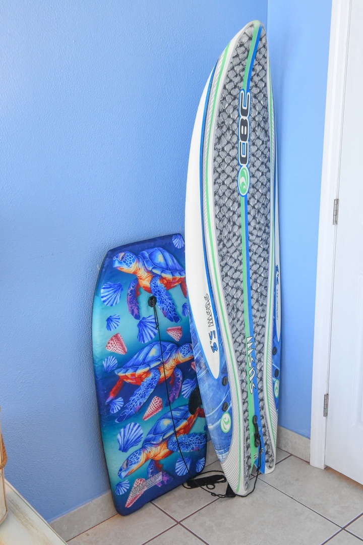 Grab your board and catch some waves—these vibrant paddleboards are ready whenever you are, perfect for exploring the surf.