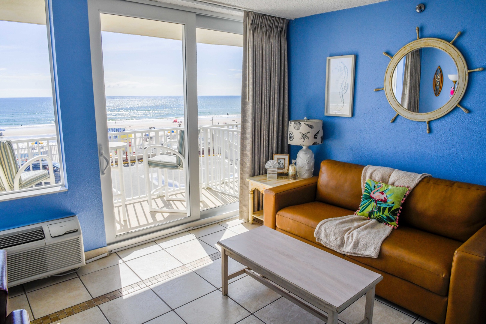 Relax in your coastal retreat with beachy décor, a plush leather sofa, and sweeping ocean views from your private balcony. The perfect spot to unwind after a day in the sun.