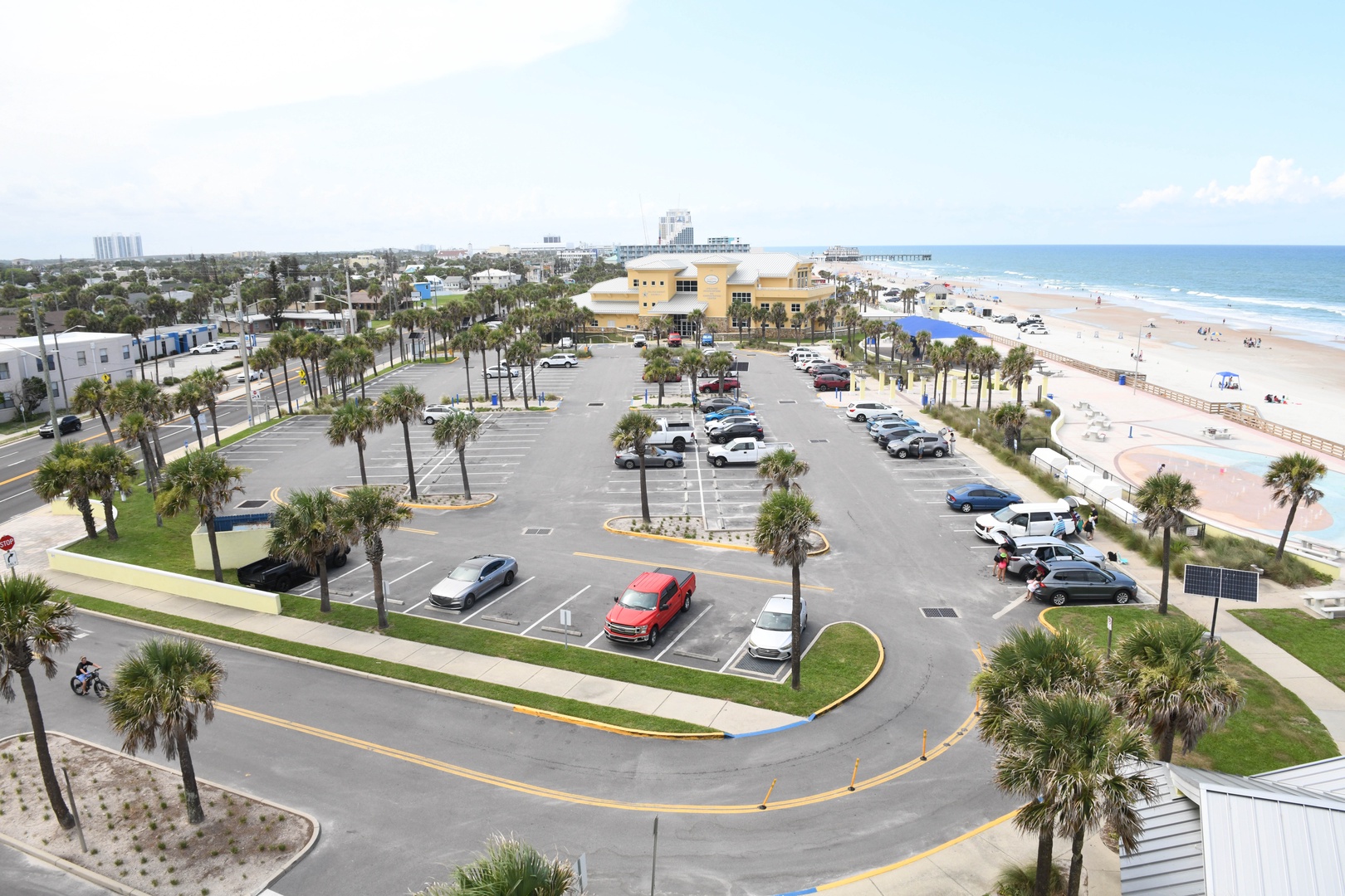 The property sits moments from a pristine beachfront surrounded by swaying palms, with convenient parking and easy access to the sandy shores and coastal charm of this vibrant destination.