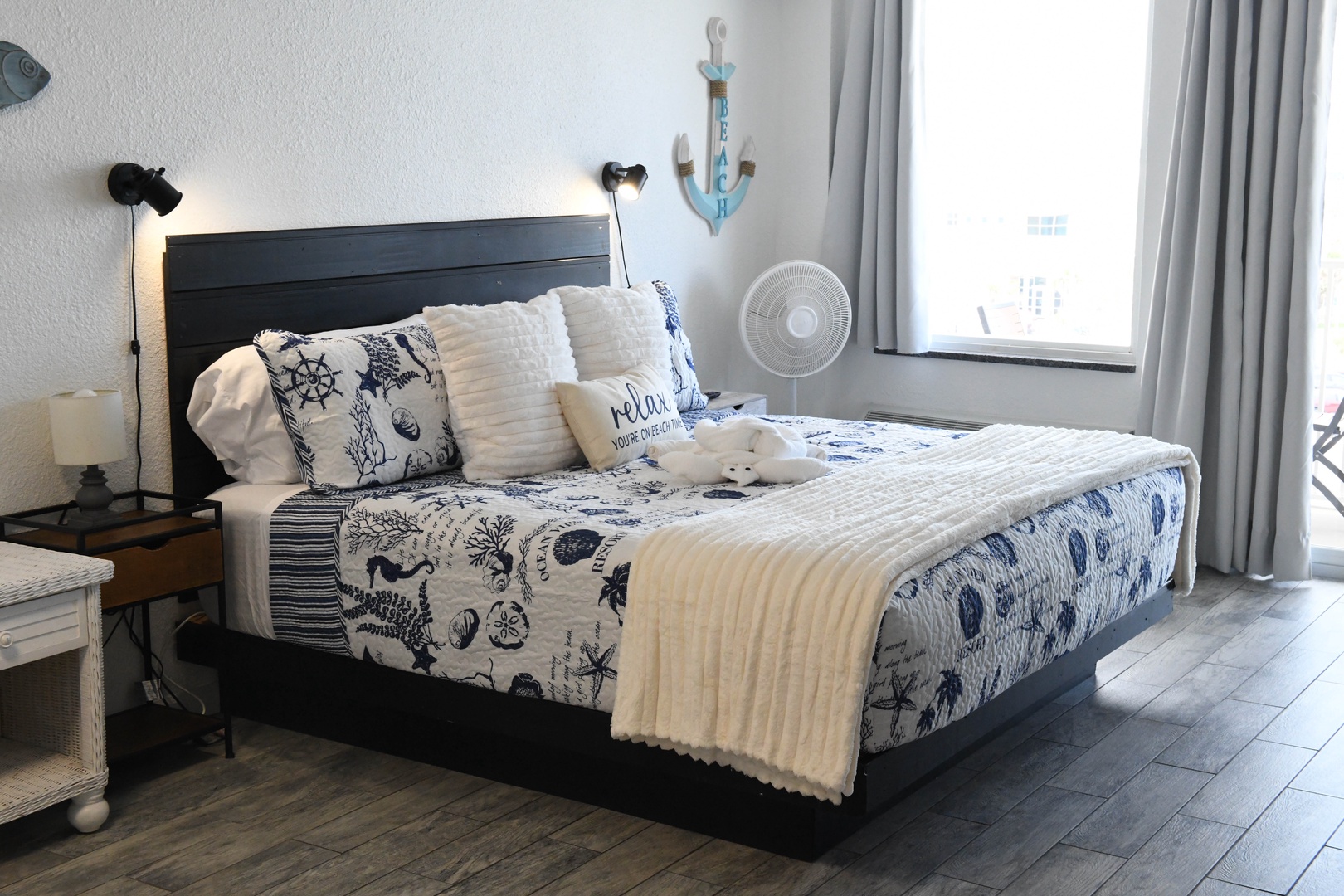 Sink into soft coastal comfort with crisp linens and nautical touches that help you unwind after your beach adventures.