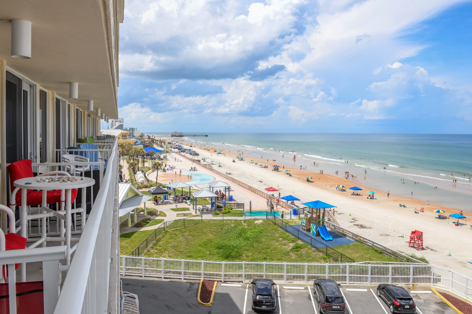 Your private balcony opens to stunning coastal views with direct access to pristine beach, playground, and oceanfront amenities perfect for families and beach lovers.