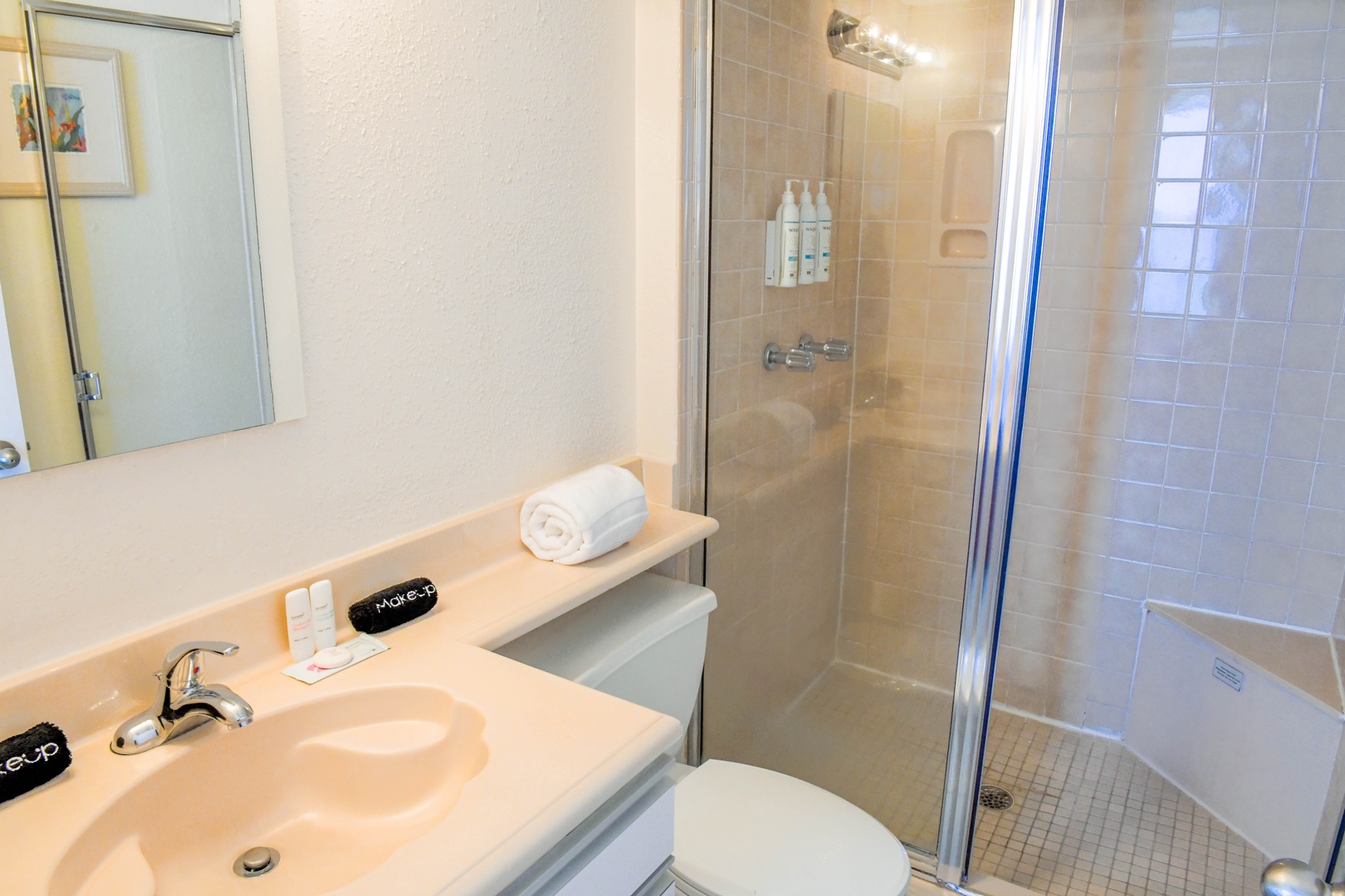 Your private bathroom features a clean walk-in shower, fresh towels, and thoughtful amenities to help you unwind after exploring the area.